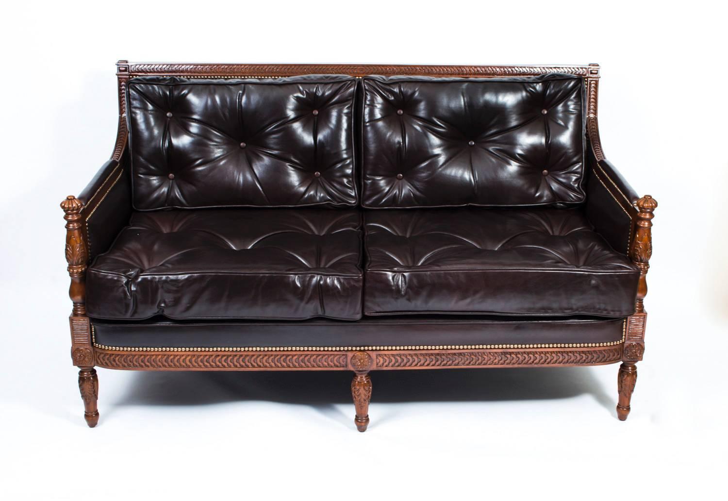 
Description this is a superb very elegant English salon sofa. 

It is made from masterly crafted, hand carved solid mahogany and it has been upholstered in sumptuous dark chocolate brown button back leather, the cushions and the closed arms and