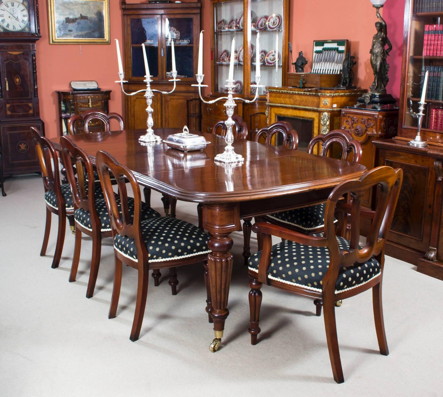 This is a beautiful antique dining set comprising a Victorian D-end mahogany dining table, circa 1850 in date and a set of eight English antique Regency dining chairs, circa 1820 in date. 

This amazing table has two original leaves, can sit eight