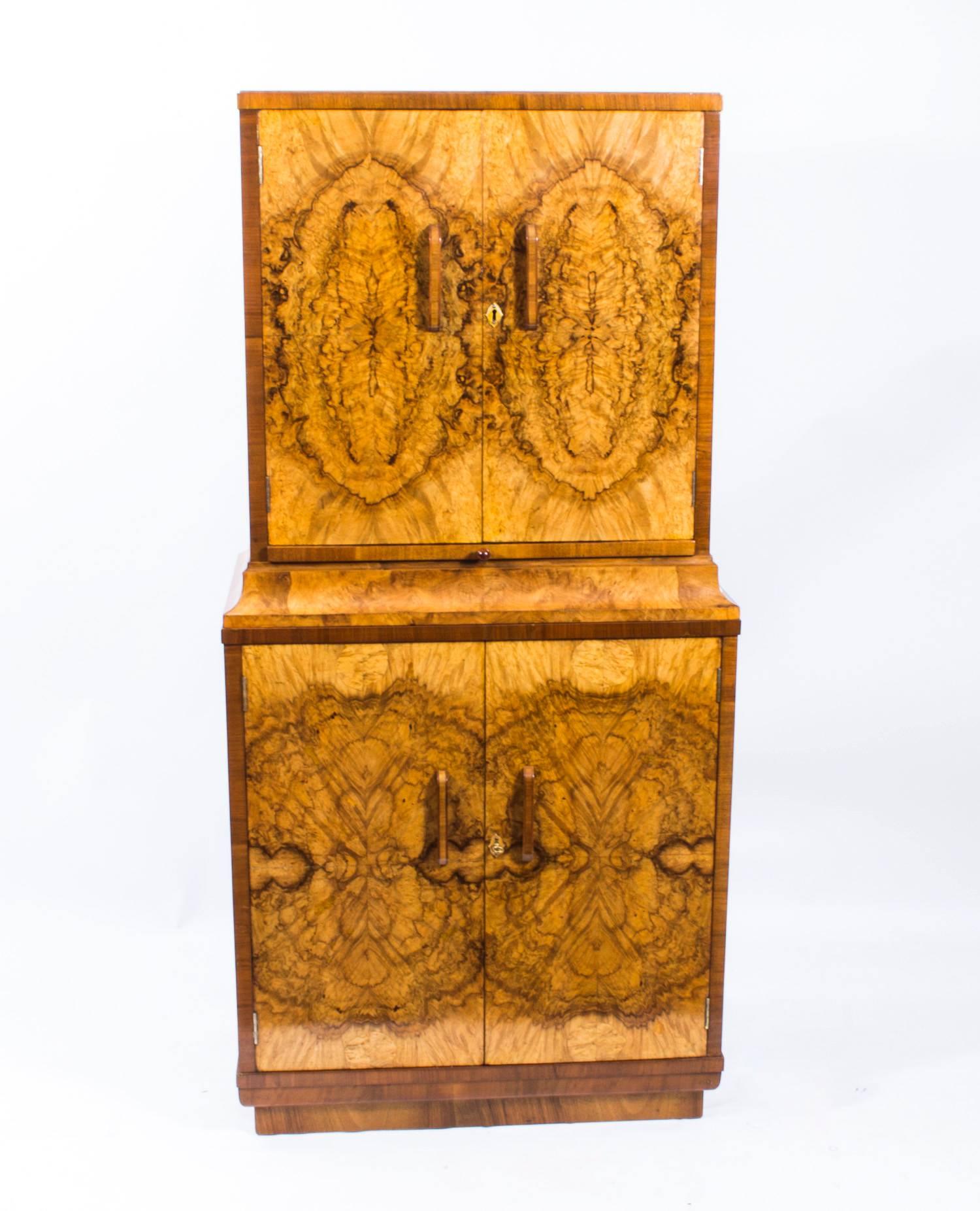 This is a fantastic antique Art Deco period burr walnut cocktail cabinet, circa 1930 in date. 

It bears the ivorine label of the renowned maker of Deco furniture, 
