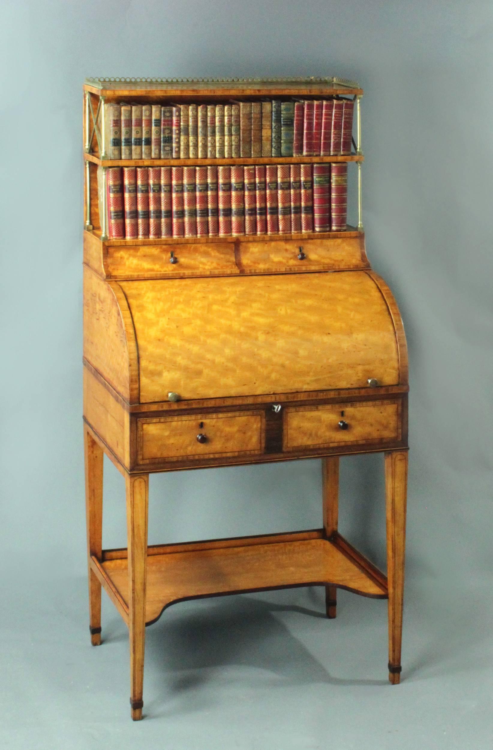A fine George III Sheraton period satinwood cylinder bookcase; good original color and patina with kingwood crossbanding, boxwood and ebony stringing and purple heart inlay.