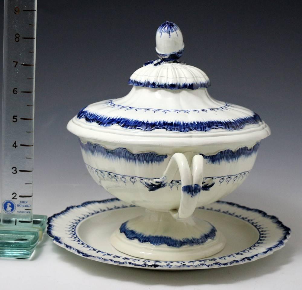 A handsome pearlware pottery tureen with cover and matching plate (10