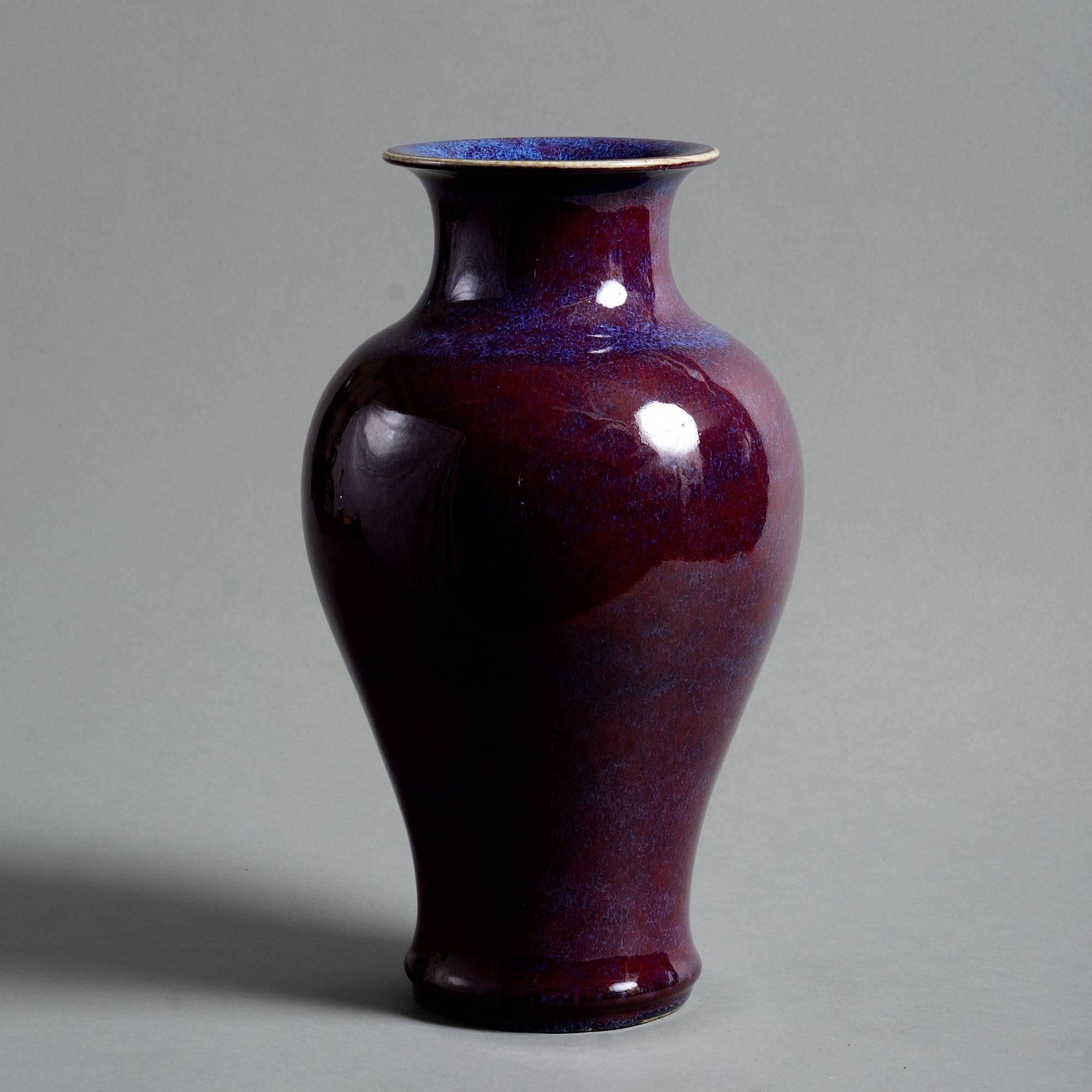 A 19th century flambé vase of baluster form, with deep purple sang de boeuf glazes. 

Qing Dynasty, Tongzhi Period.