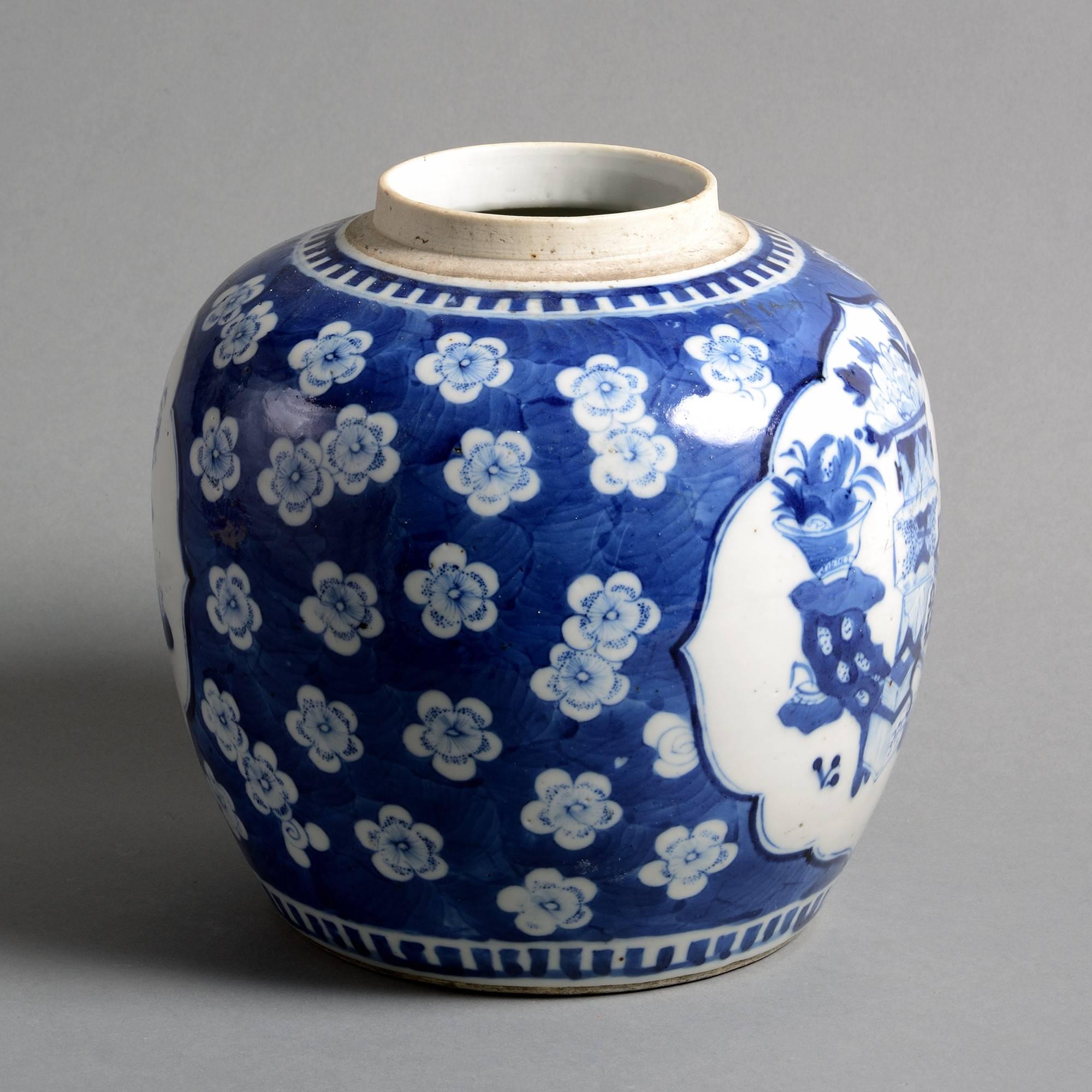 A 19th century blue and white glazed porcelain jar, the body decorated with cartouches of domestic furniture and objects upon a blue ground of white prunus blossom. 

Made for the European export market. 

Qing dynasty, Guangxu period.
  