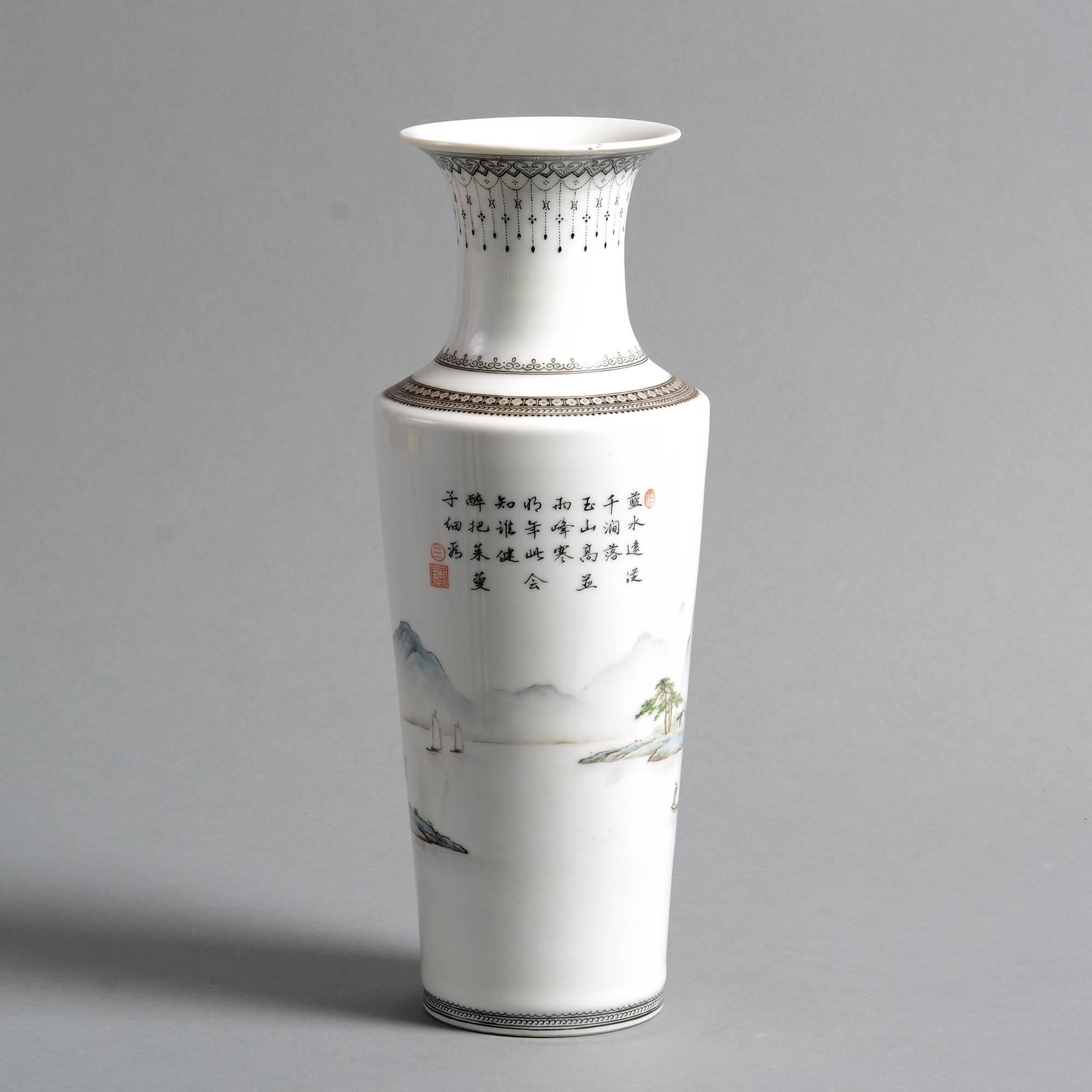 An early 20th century porcelain vase, having a trumpet neck and cylindrical tapering body, decorated throughout with figures in an imaginary mountainous seascape. With characters. 

Republic of China (1912–1949).