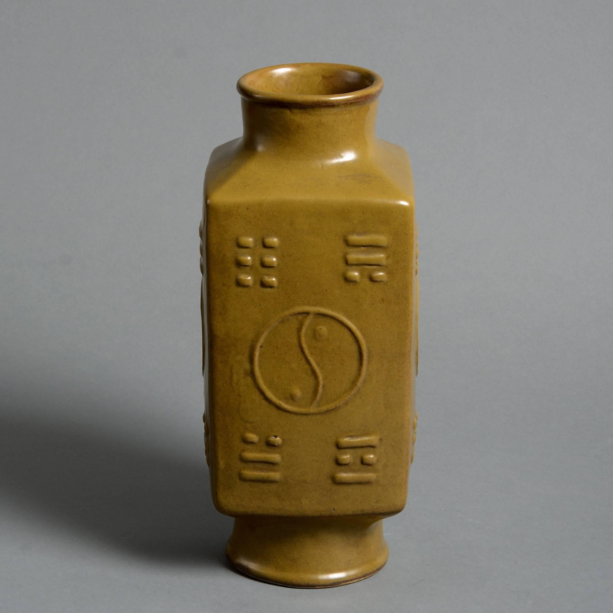 An unusual mid-19th century porcelain tea dust glazed vase, of square form, having impressed decoration and character mark to the underside. 

Qing dynasty, Tongzhi period.