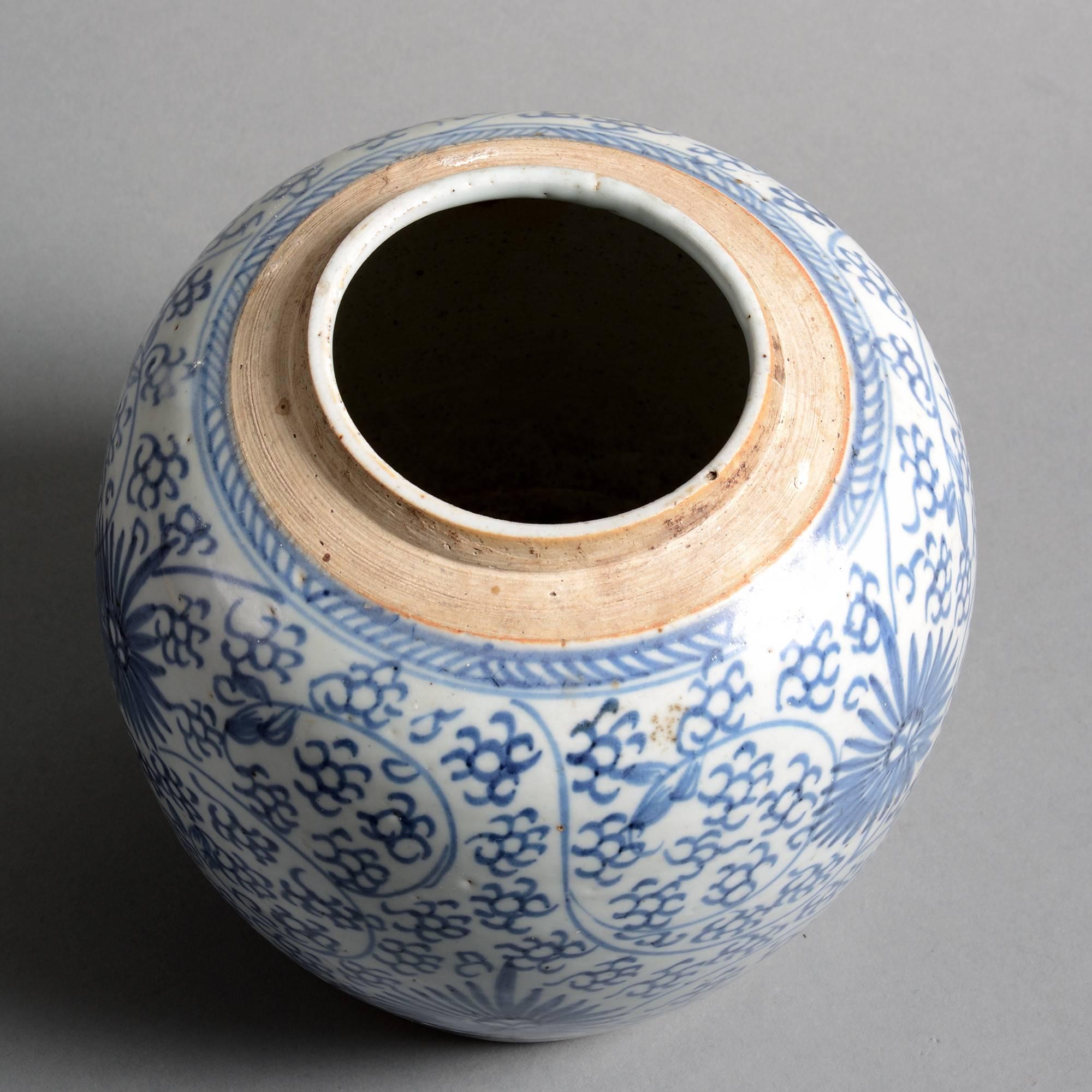 A late 18th century blue and white glazed porcelain jar of bulbous form, decorated throughout with stylized flowers and foliage. 

Qing dynasty, Jiaqing period.

Good condition with old star crack to underside of base.