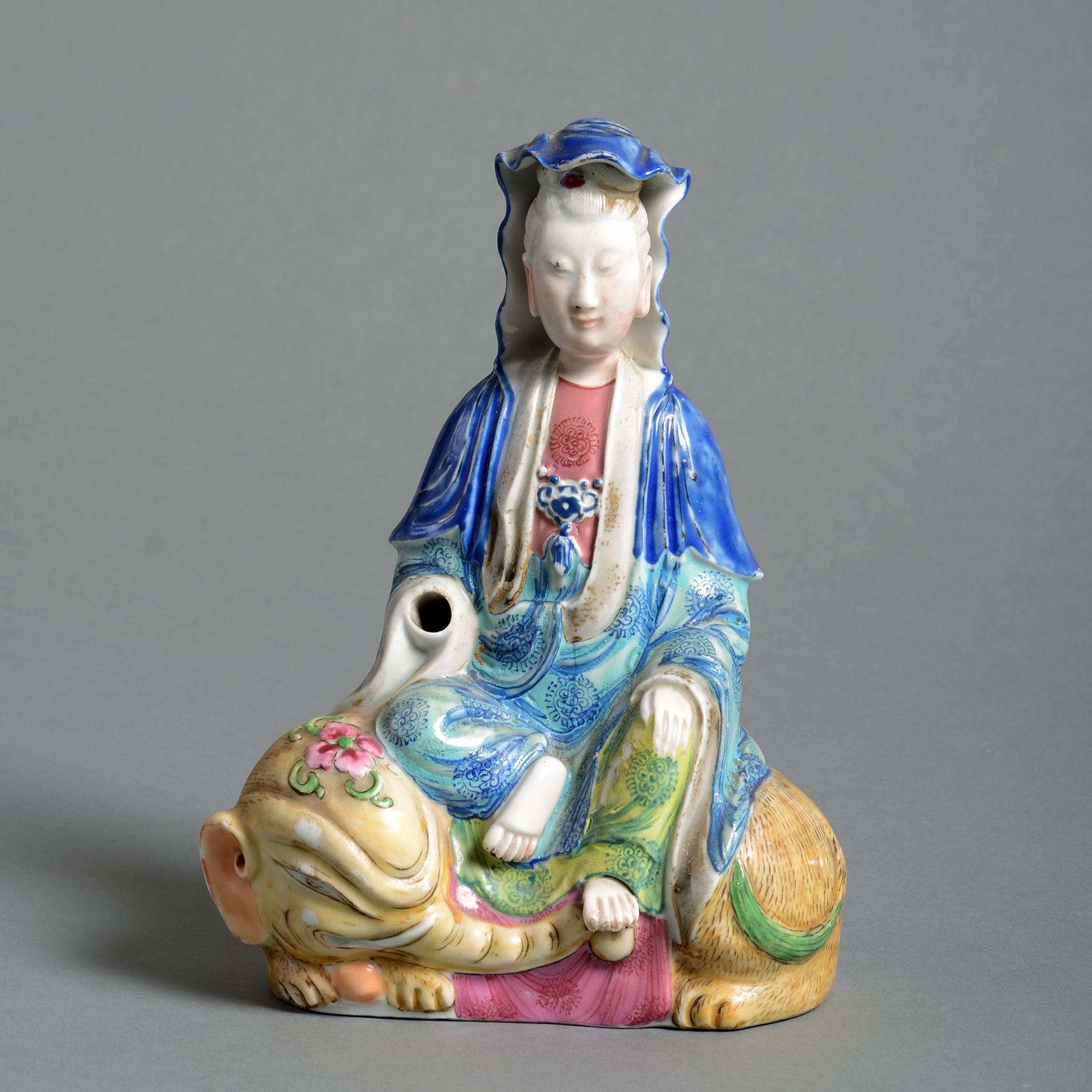 A late 19th century polychrome porcelain figure, depicted seated upon a recumbent elephant. 

Qing dynasty, Tongzhi period (1861-1875). 

Condition: Good, but missing one hand.