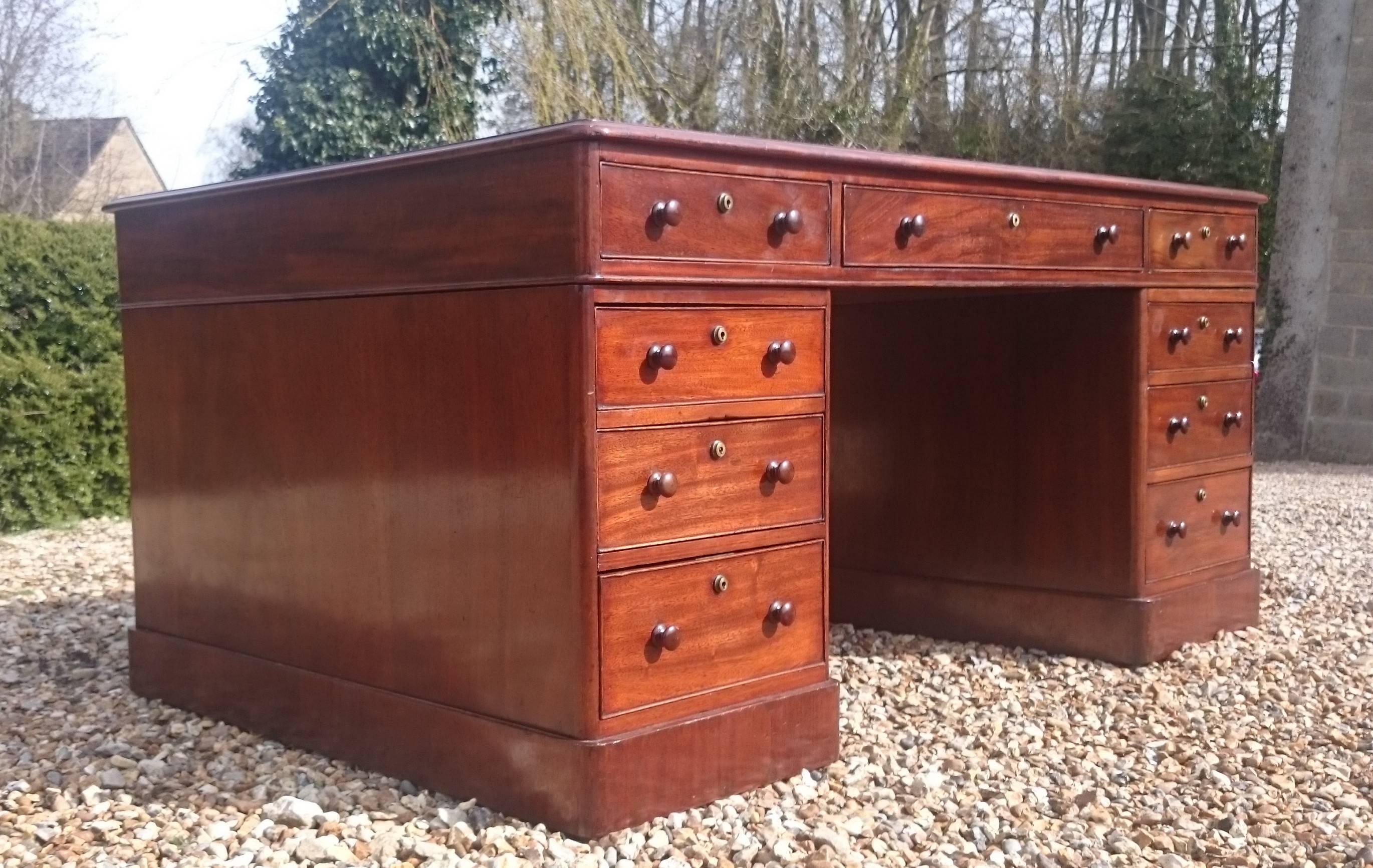 Good large-scale antique partners pedestal desk. This desk has drawers both sides, plenty of knee room and patented warranted locks made by Mordan & Co of Finsbury in London. They look at bit like Brahma locks. The drawers are graduated with the