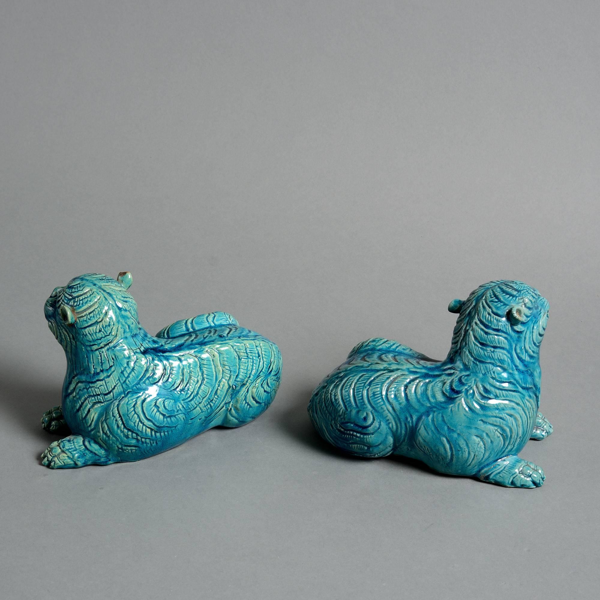 A pair of late 19th century turquoise glazed porcelain leopards, modelled seated. 

Qing dynasty.
Guangxu period (1875-1908).  

Condition: Good with a chip to one ear.
