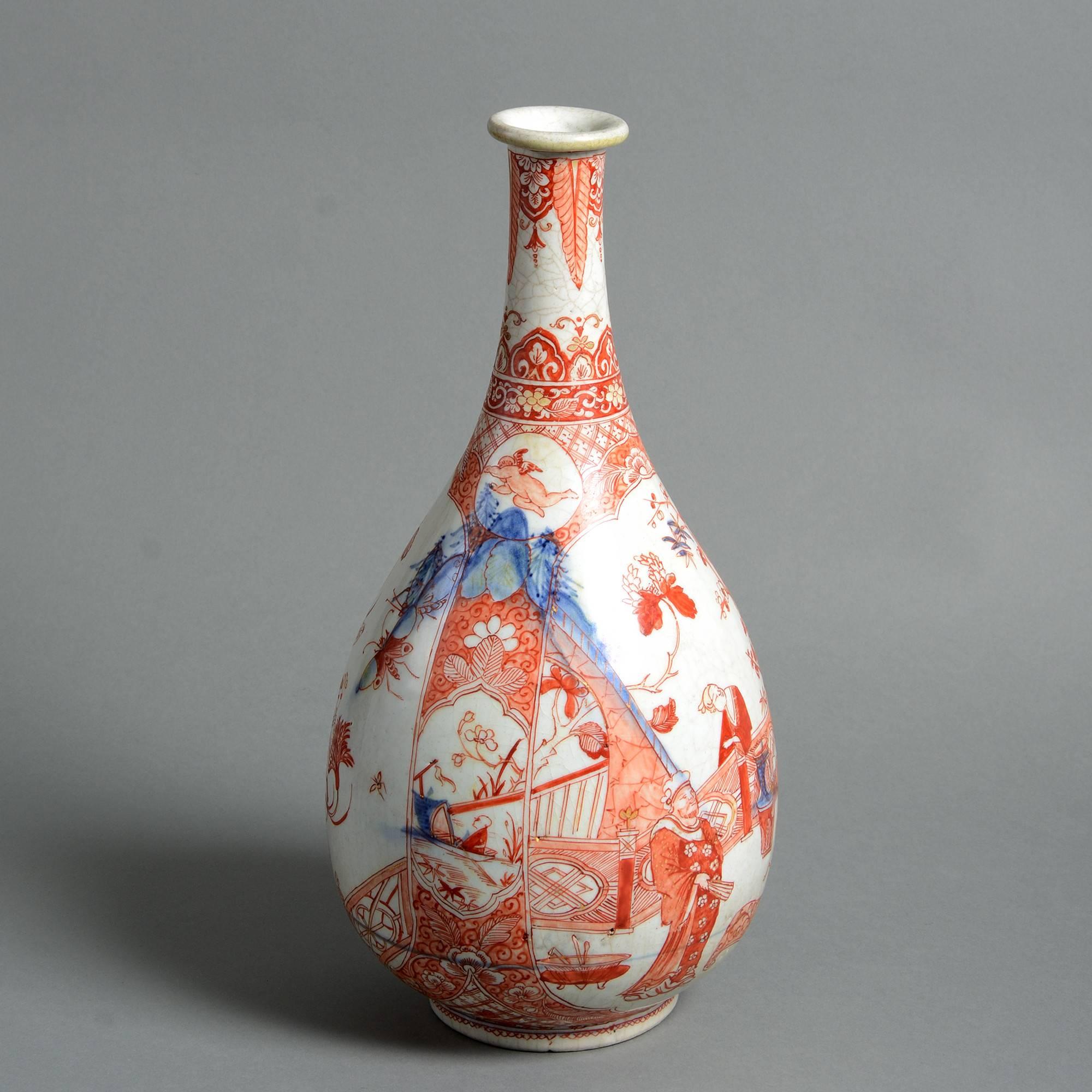 A rare late 17th century clobbered Arita porcelain bottle vase, having decoration in later applied red upon a blue and white glazed body. 

Edo period.