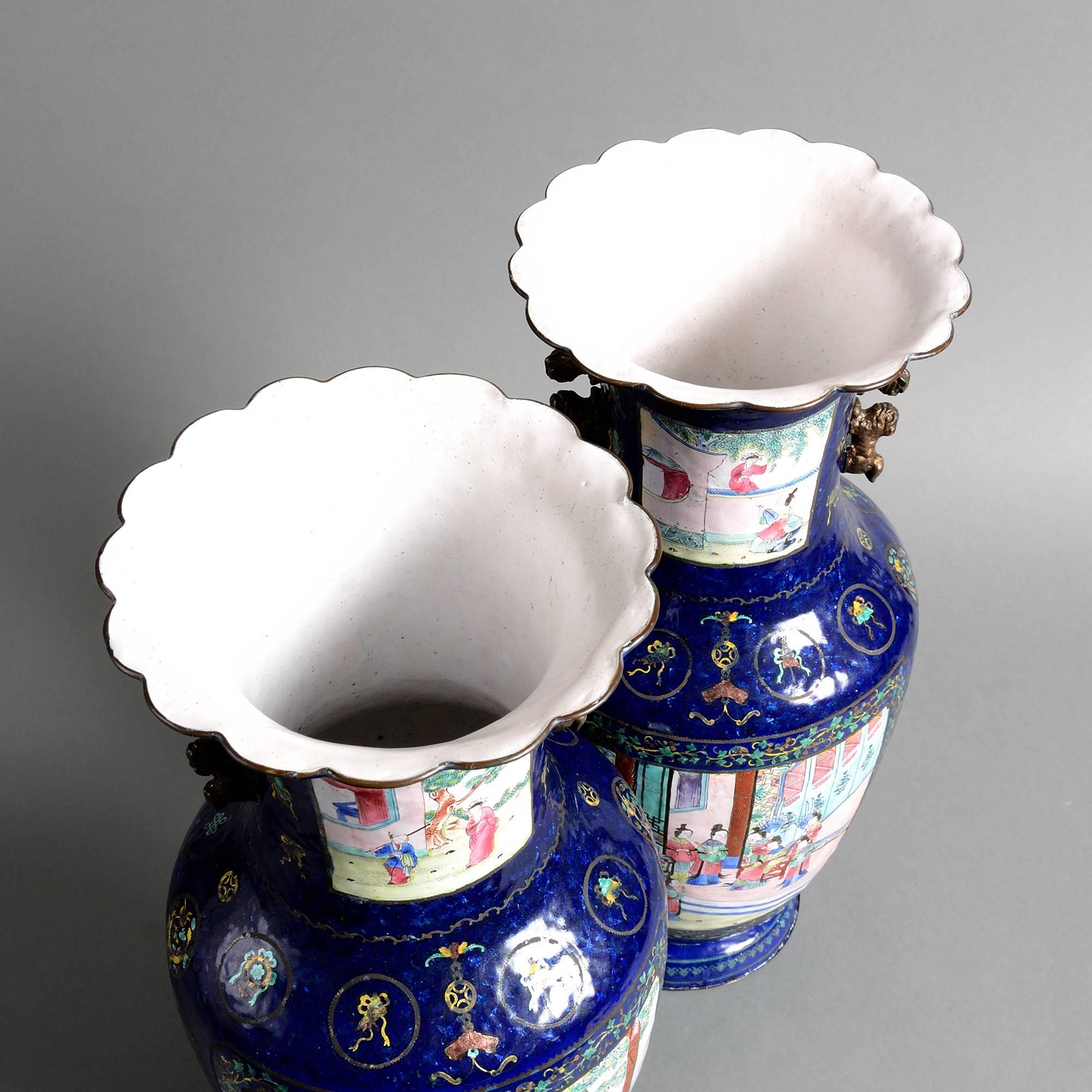 Chinese Pair of 19th Century Canton Dark Blue Enamel Vases with figurative court scenes