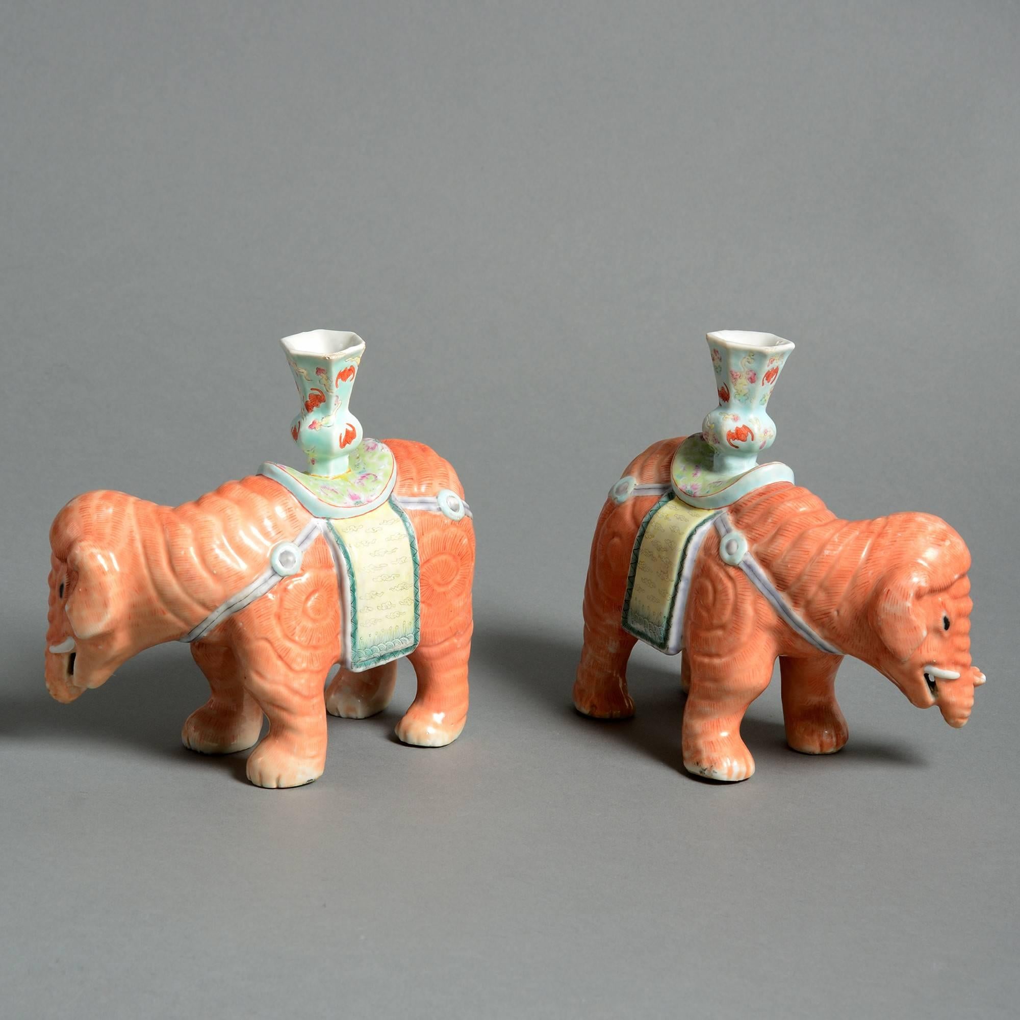 A pair of late 19th century export porcelain candle holders, modelled in the form of elephants. 

Qing dynasty, Guangxu Period (1875-1908).
    