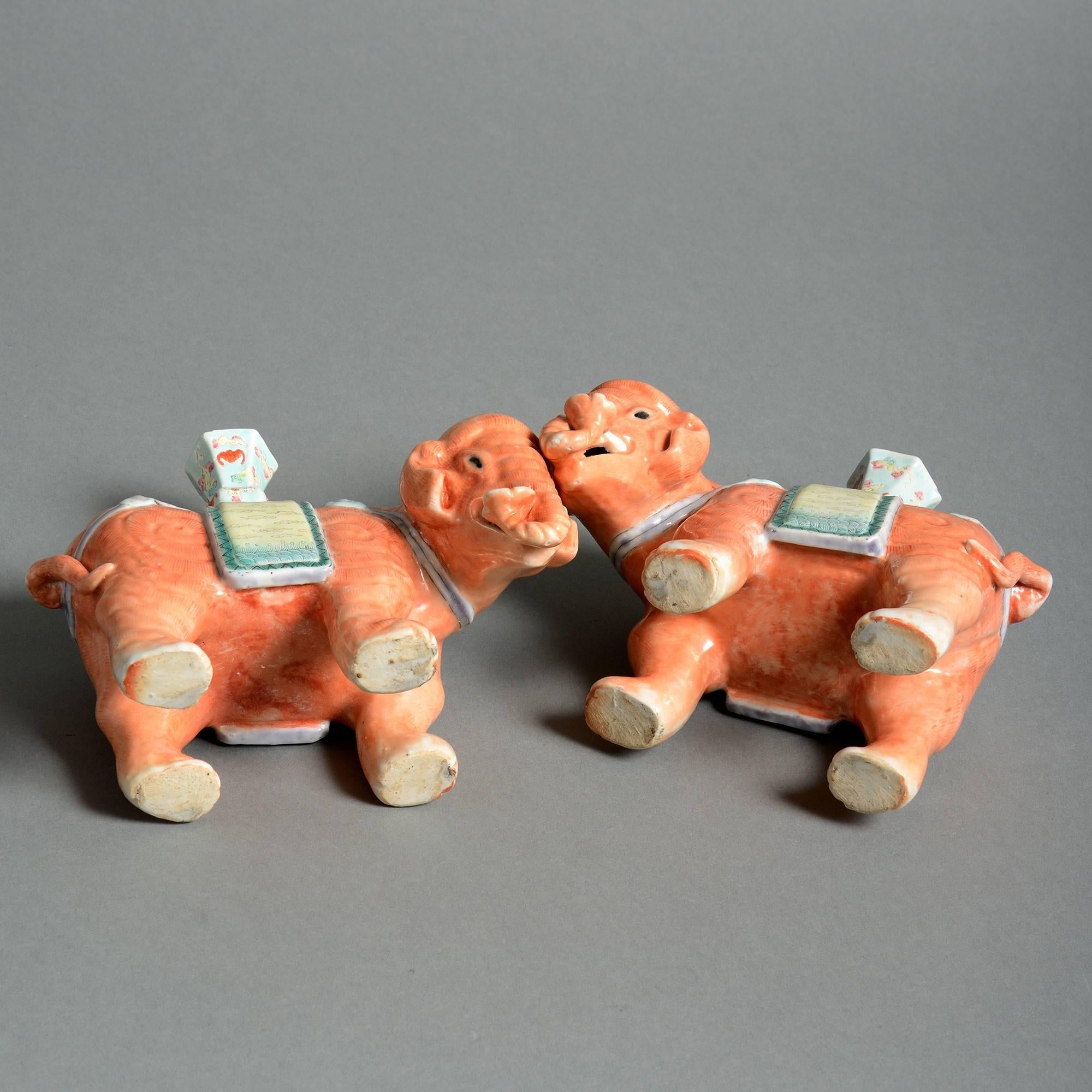 Chinese Pair of Porcelain Orange Elephant Candle Holders