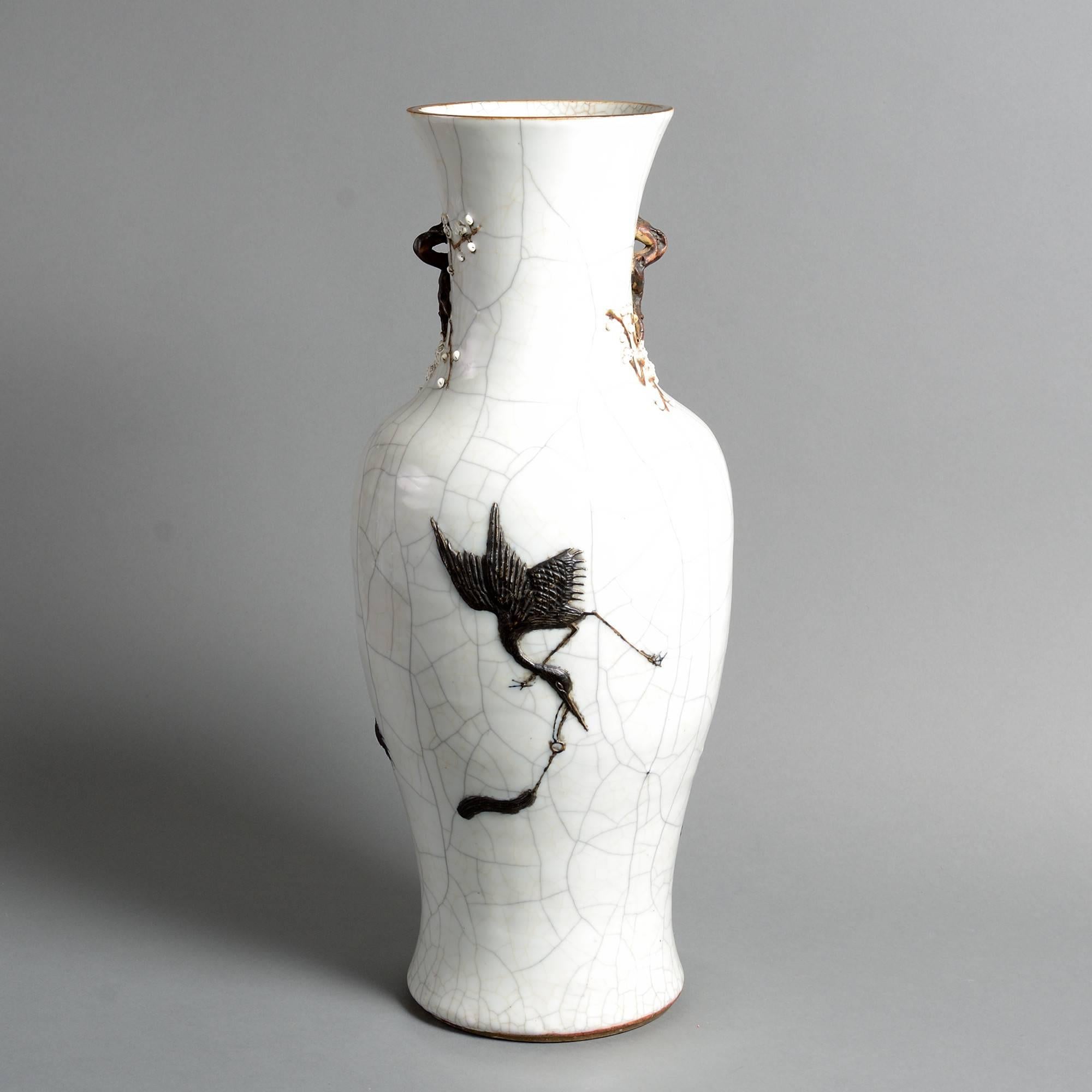 A late 19th century porcelain vase, having an applied black glazed dragon upon a white crackle ground. 

Qing dynasty.

Guangxu period (1875-1908).