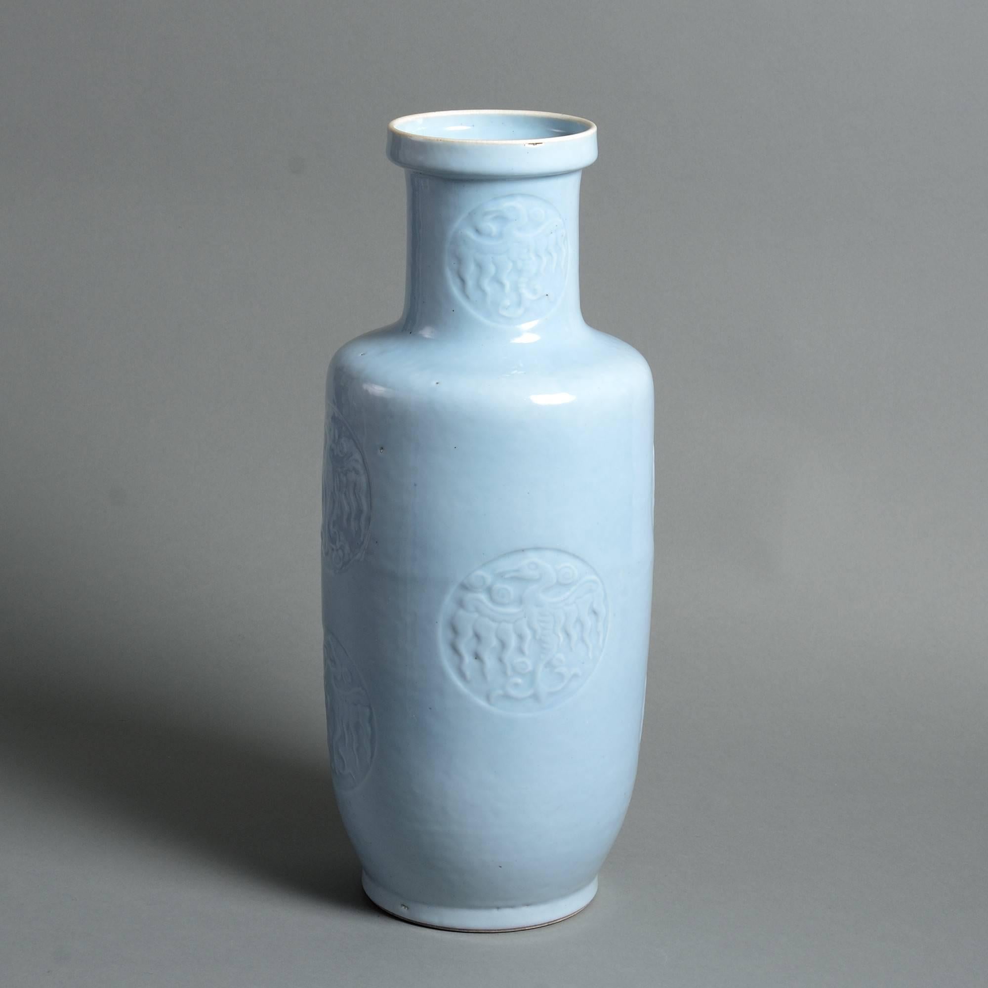 A fine mid-19th century clair de lune glazed porcelain rouleau vase, the body with decoration in shallow relief. 

Qing dynasty, Xianfeng period (1851-1861).

Good condition with some firing imperfections to rim and body.