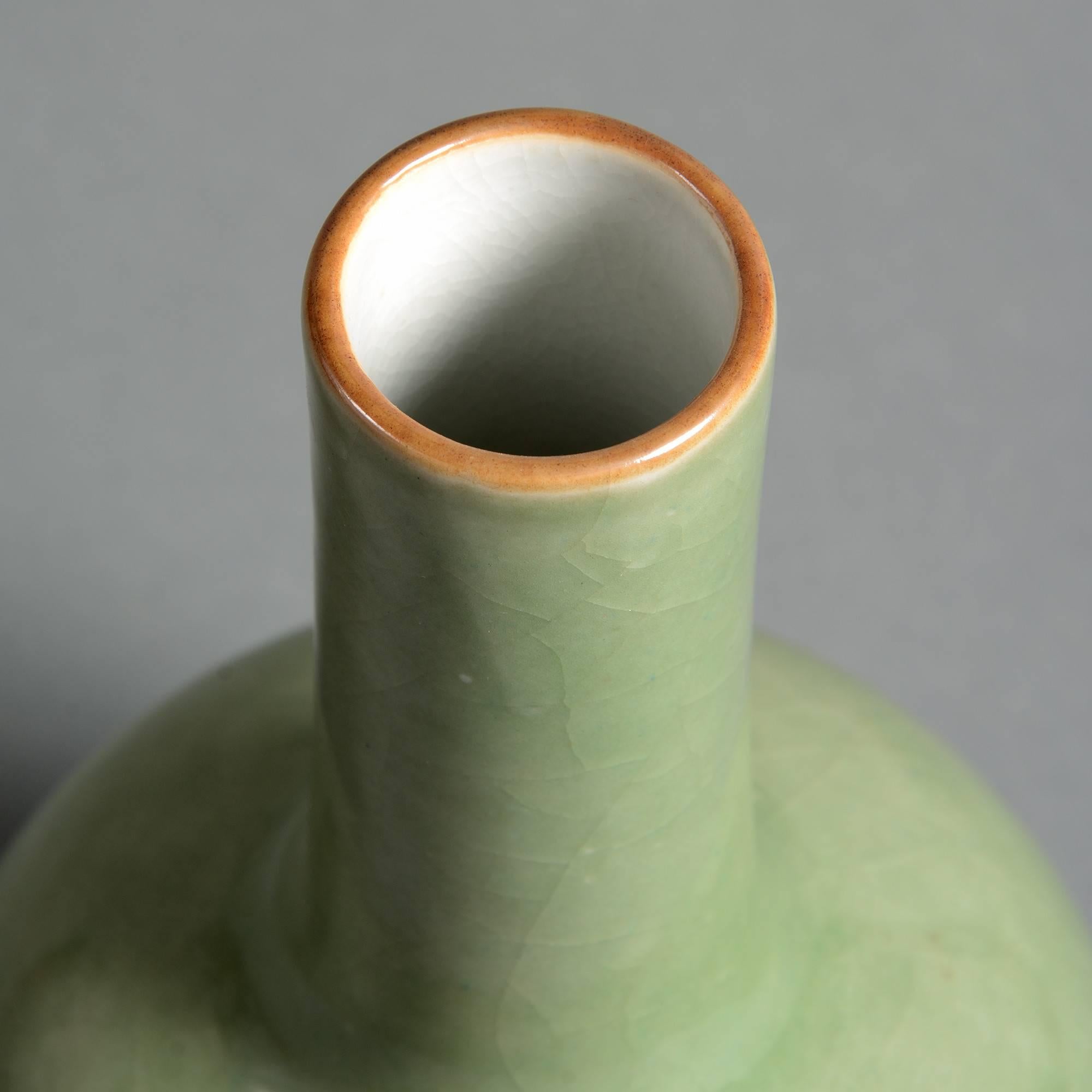 A late 19th century celadon porcelain bottle vase having a soft crackle glaze throughout. 

Qing dynasty, Guangxu Period (1875-1908).