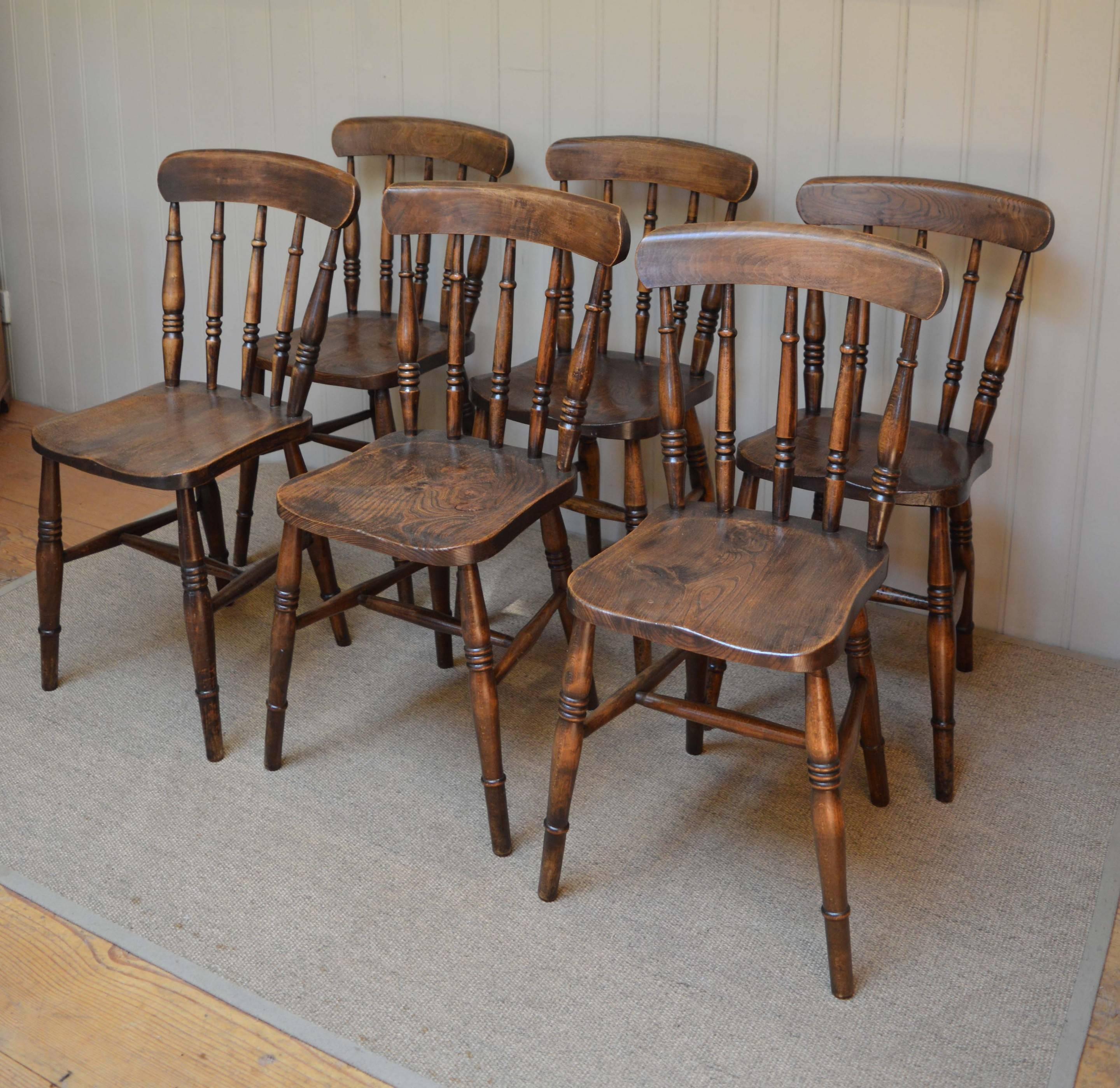 A set of six spindle back Windsor chairs. Of traditional form, having a beechwood frame and rail and back with a figure elm seat.
The seat is 43 cm high from the floor.