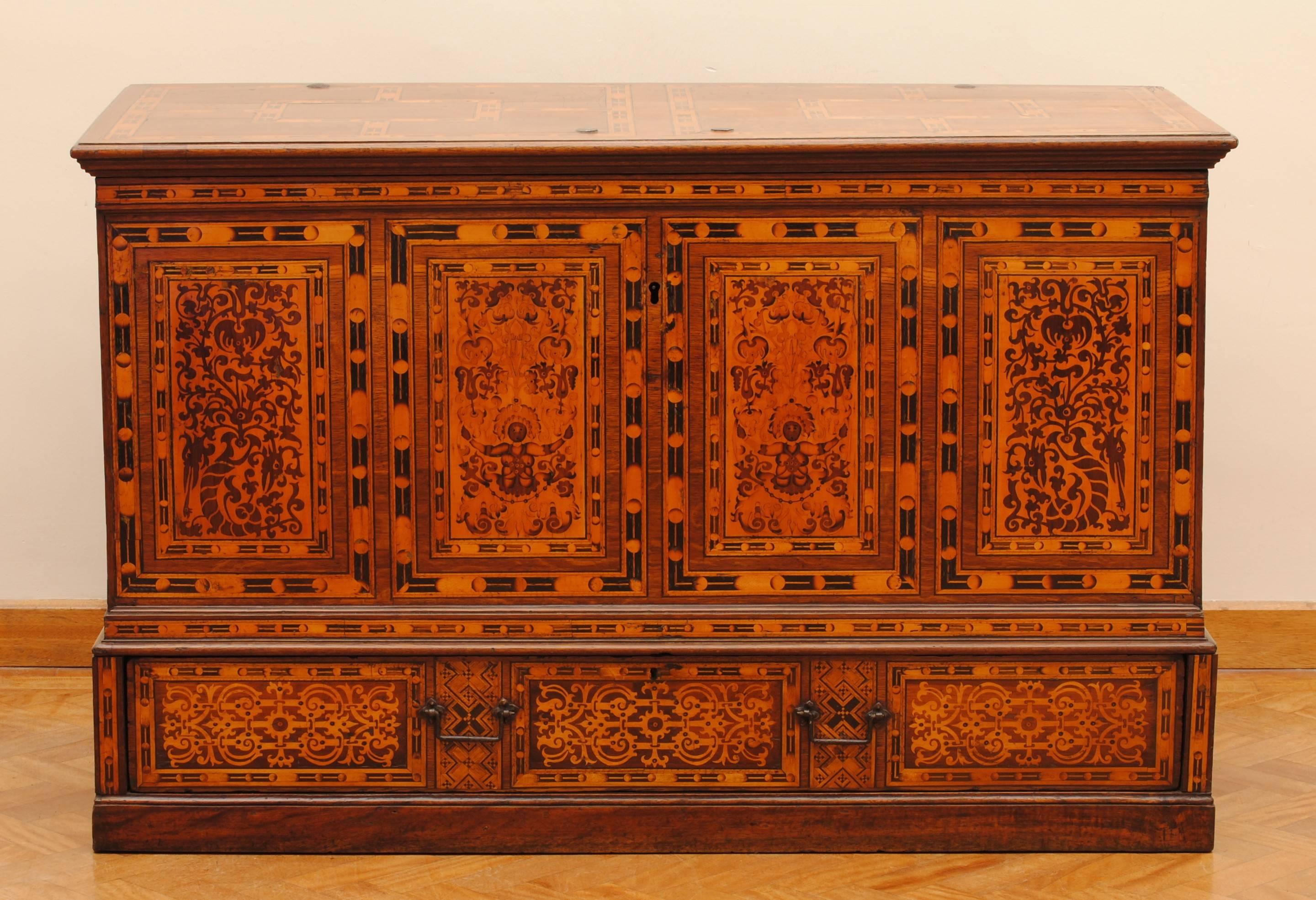 A fantastic German marquetry chest with fine marquetry inlaid decoration.