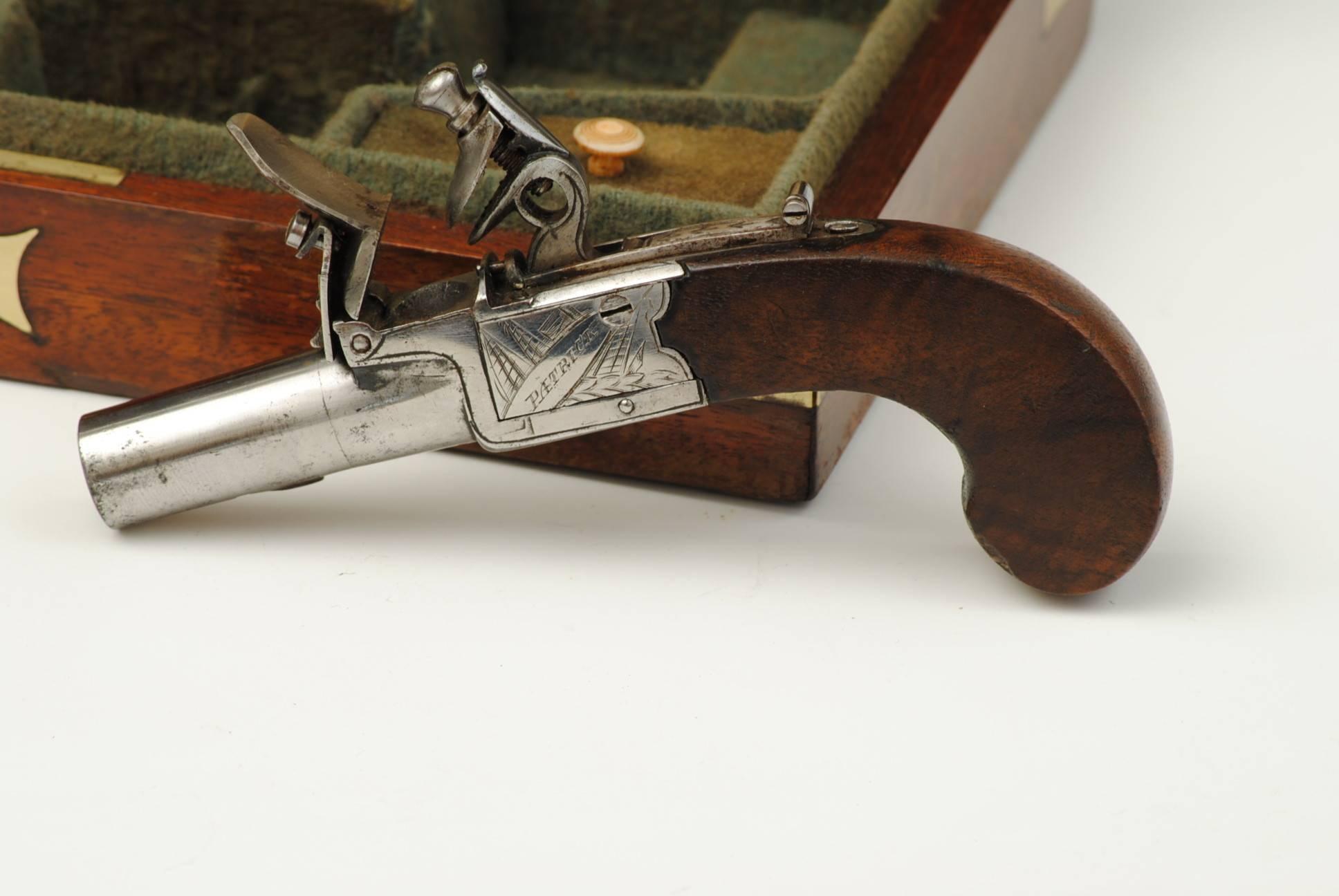 A super pair of box lock pistols in wonderful condition by Edward Patrick of Liverpool , contained in the original mahogany brass bound case with a trade label in the lid. The case contains the original bullet mould and turn key.