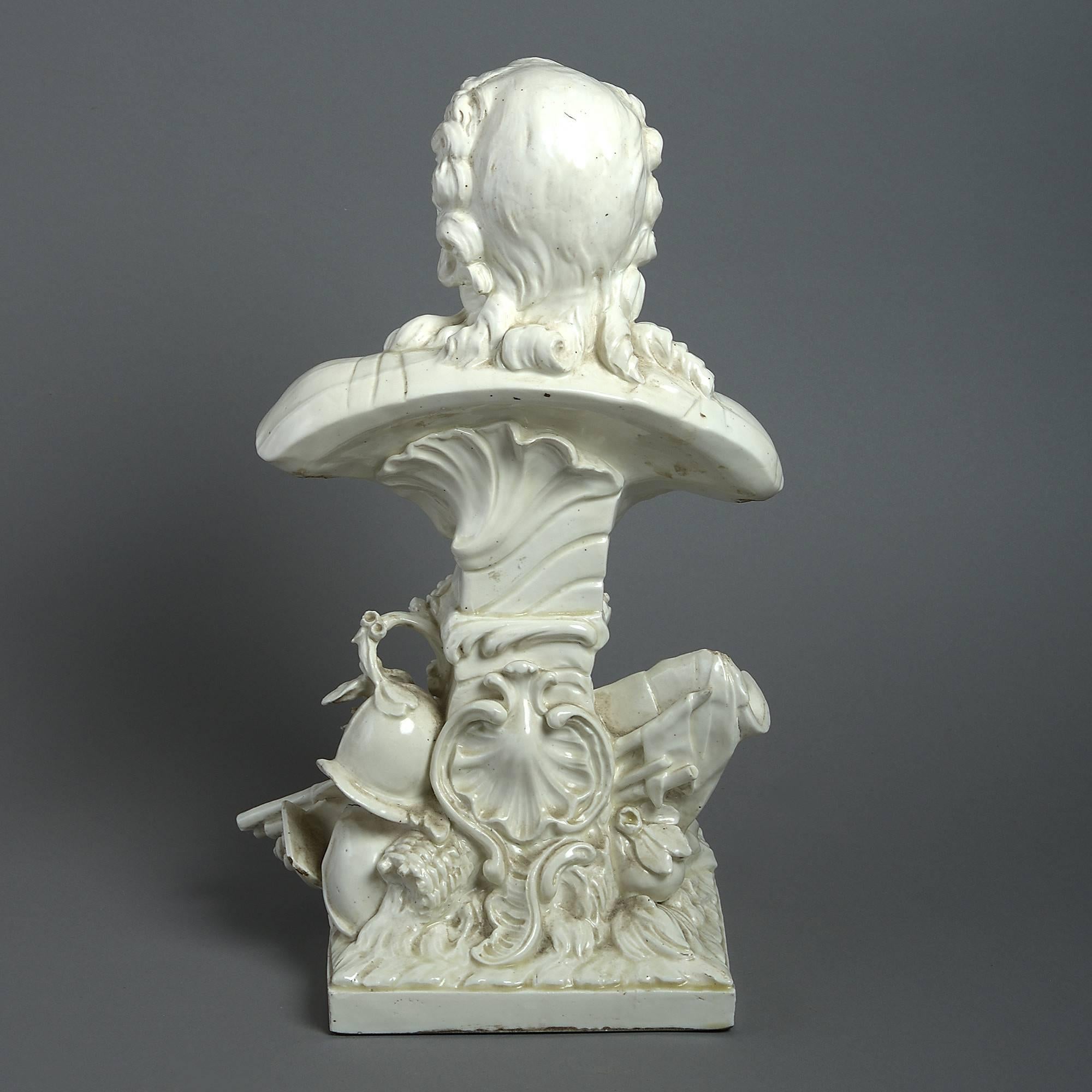 A rare early 19th century creamware bust of good scale, depicting King Louis XV of France, set upon a shaped Rocaille socle, mounted with trophies of war.

Louis XV, known as Louis the beloved (Louis le bien aimé), reigned as King of France from