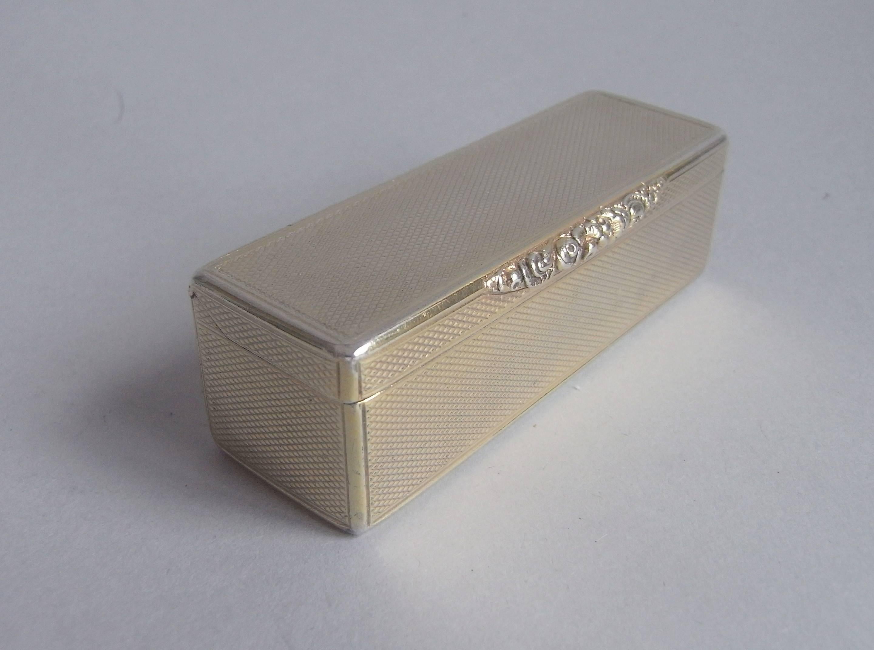 This very unusual pocket snuff box is of a deep narrow rectangular form, with slightly curved top. All the sides are crisply engraved with engine turning and have a plain outer border. This piece is in excellent condition and also has a cast