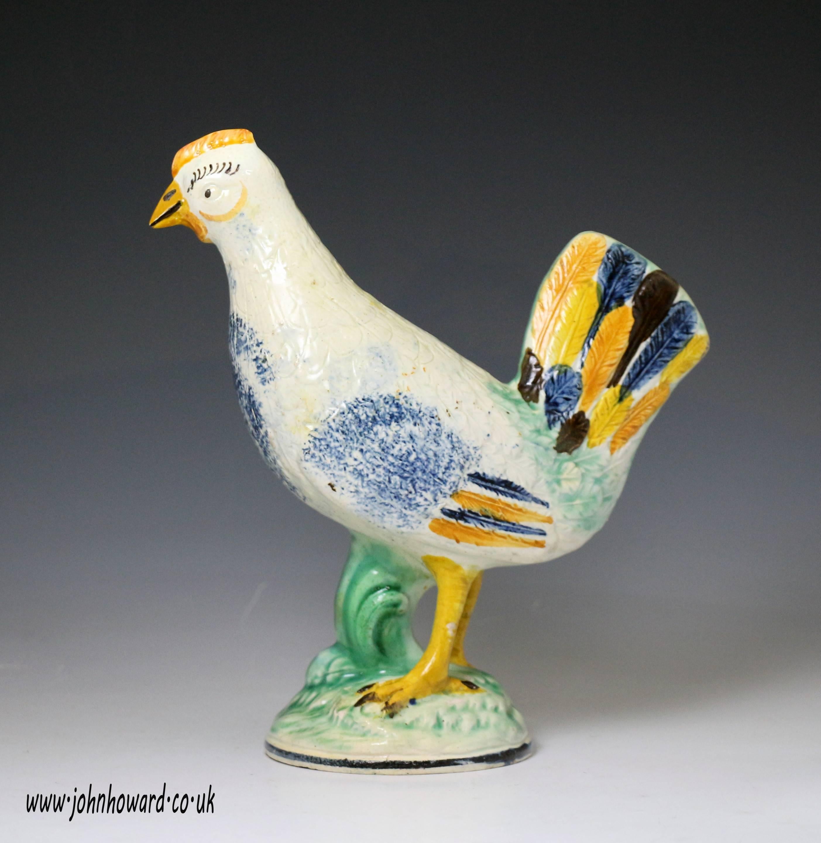 A fine English pottery prattware pottery standing figure of hen on base. 
The figure is crisply and character fully modelled with good application of color.