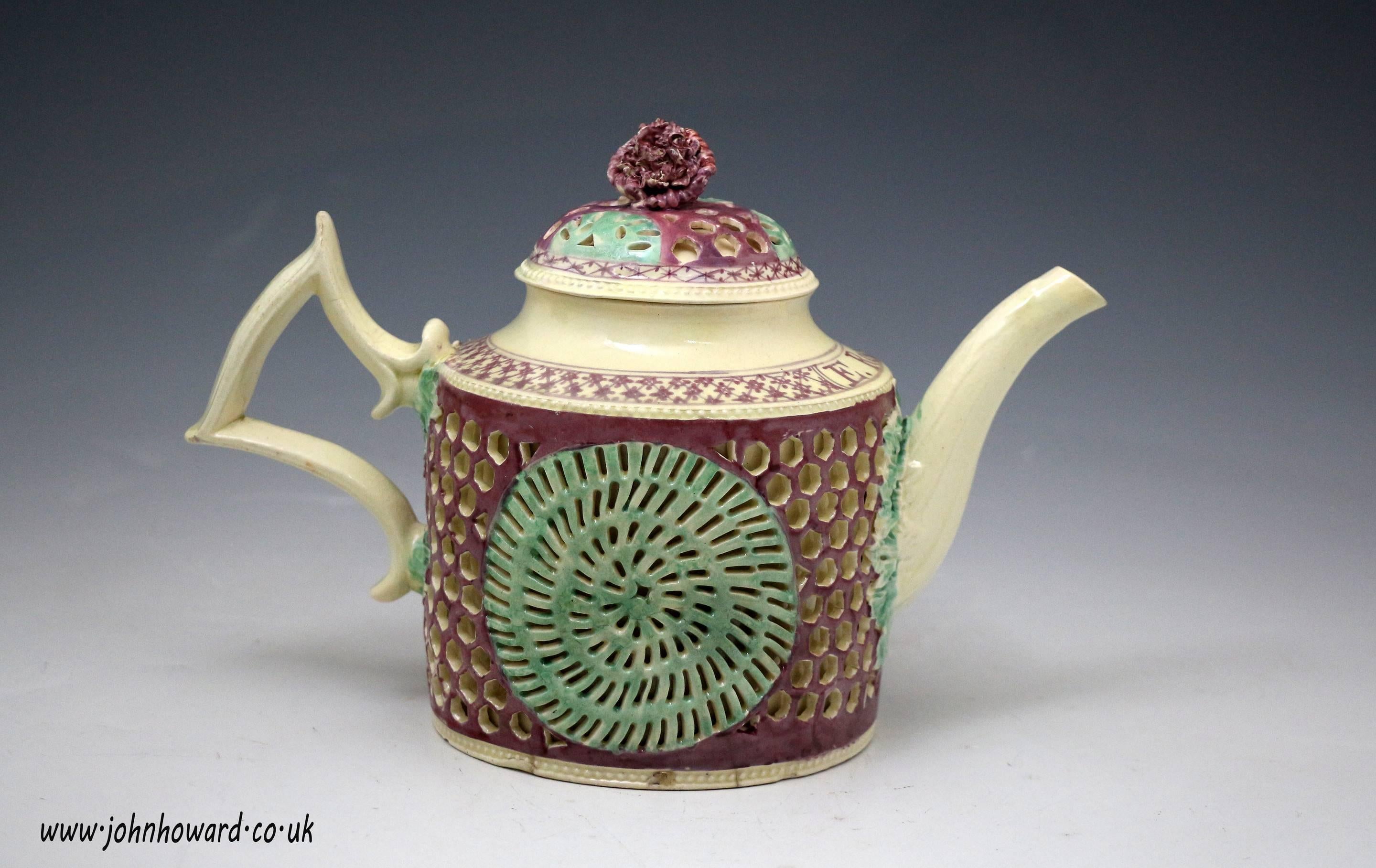 An exceptionally rare antique creamware pottery teapot with enamel colours. 
The teapot is 