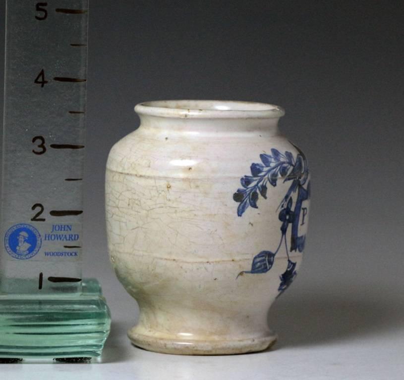 A rare small scale apothecary drug jar for Laudinum ( tincture of opium) . Decorated in blue and white with the legend in Latin 