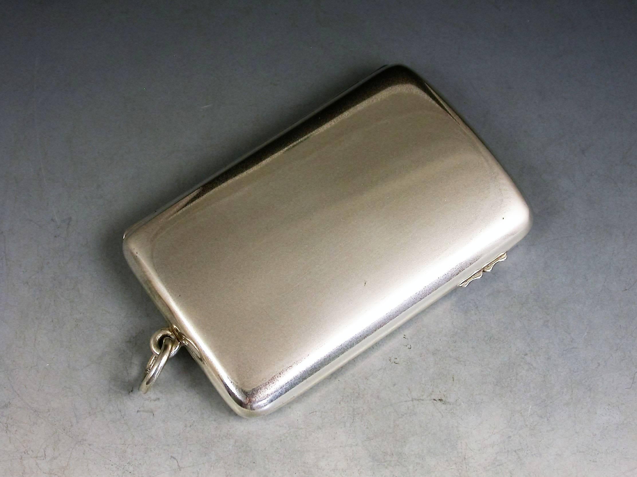 A rare and large Victorian silver triple sovereign and note holder case of plain curved rectangular form with attached suspension ring and sprung hinge. The silver gilt interior with three sprung sections to accept full (2) and half sovereigns (1).