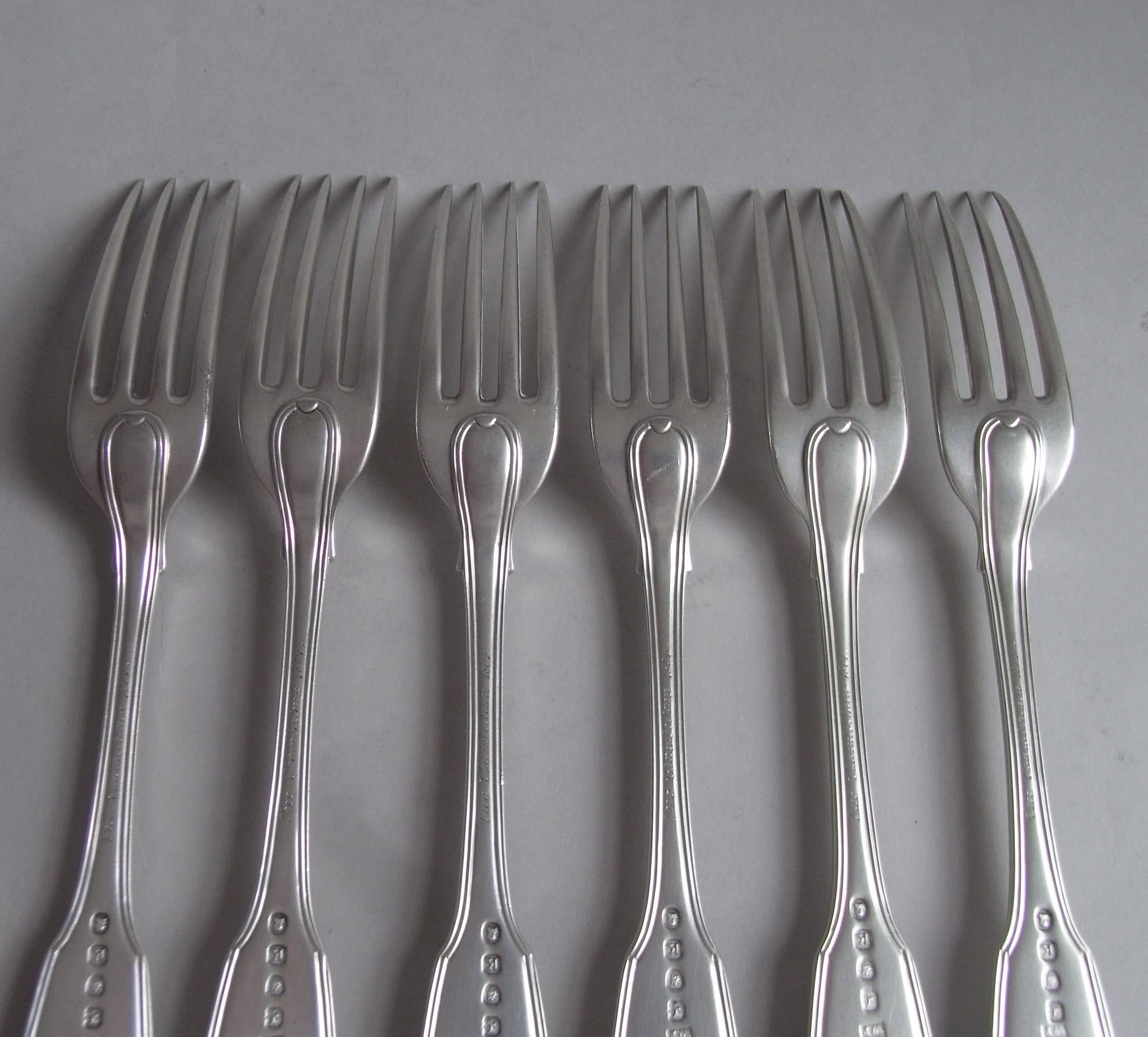 These very fine table forks are modelled in the fiddle and thread pattern and are double struck. Each is very well marked and are of a very good weight and gauge of silver. The top of each stem is engraved with the Royal Arms as used by King George