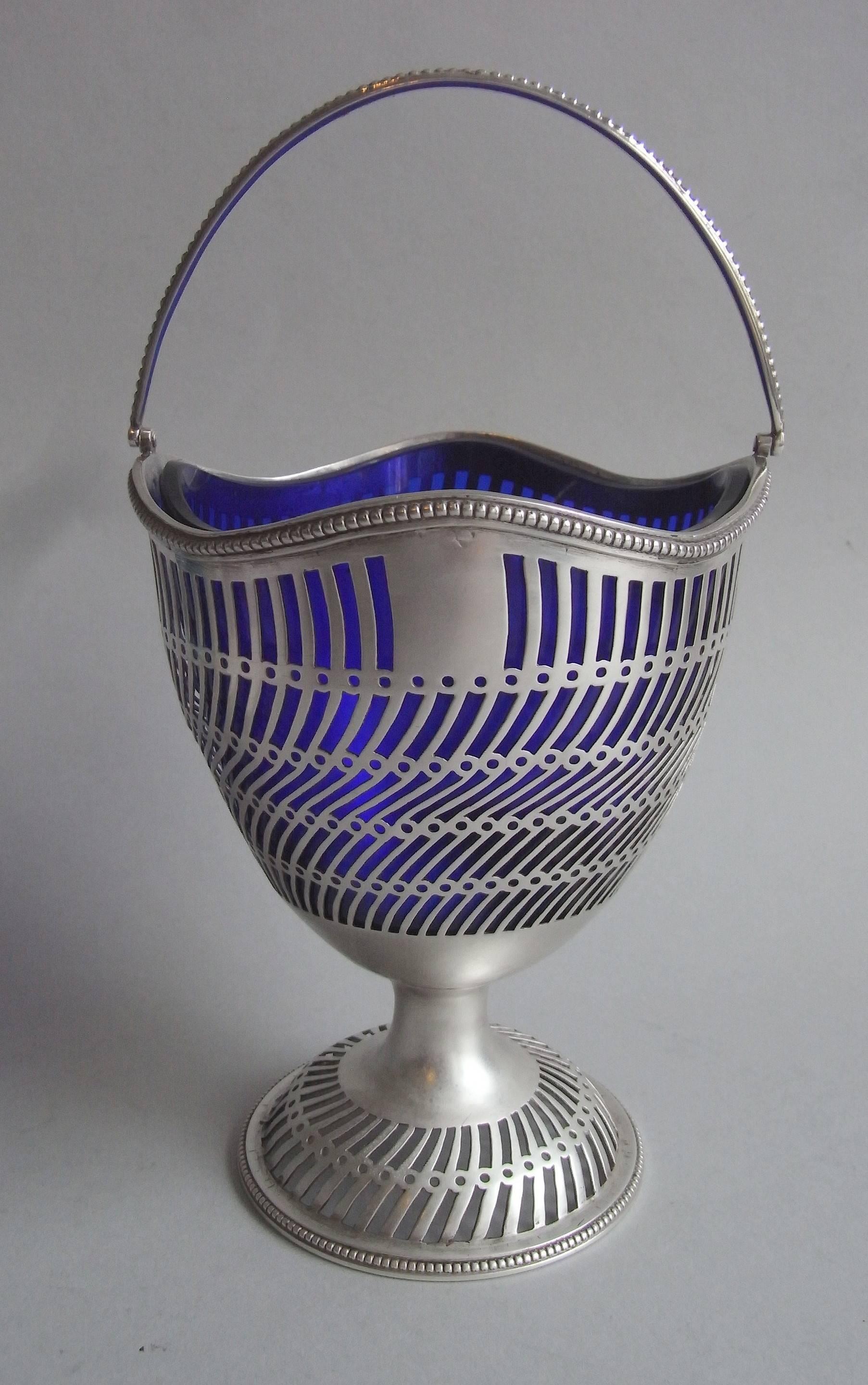 The Sugar Basket is most unusual as its surface is nearly entirely pierced. This is the first time we have seen so much of a piece, by Hester Bateman, covered in pierced work and the design is most unusual as well. The domed foot has a beaded rim