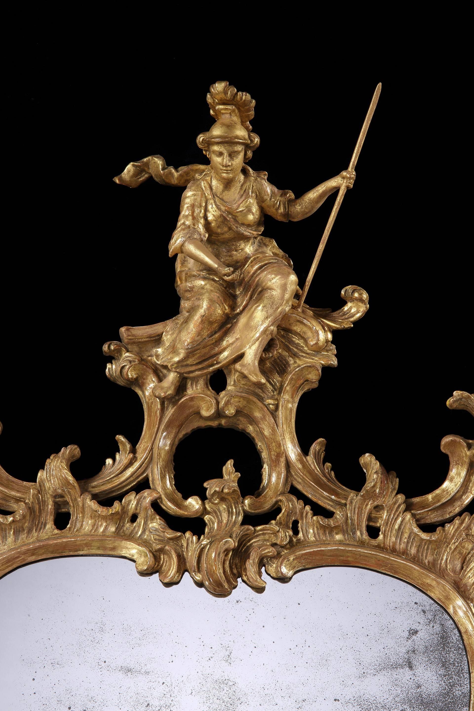 A George II giltwood pier mirror. 

The mirror has replaced 18th century mirror plates. 

No other comparable example has come to light.