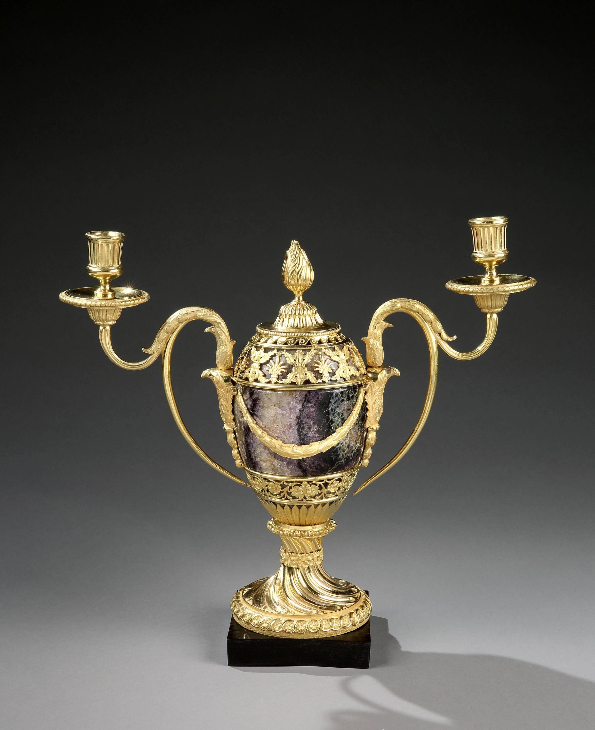 Matthew Boulton produced various models of candle vases in different sizes; this is one of the largest. The candle arms are unusual for this model and to date this is the only pair known pair with this type of arm. The usual version is the scroll