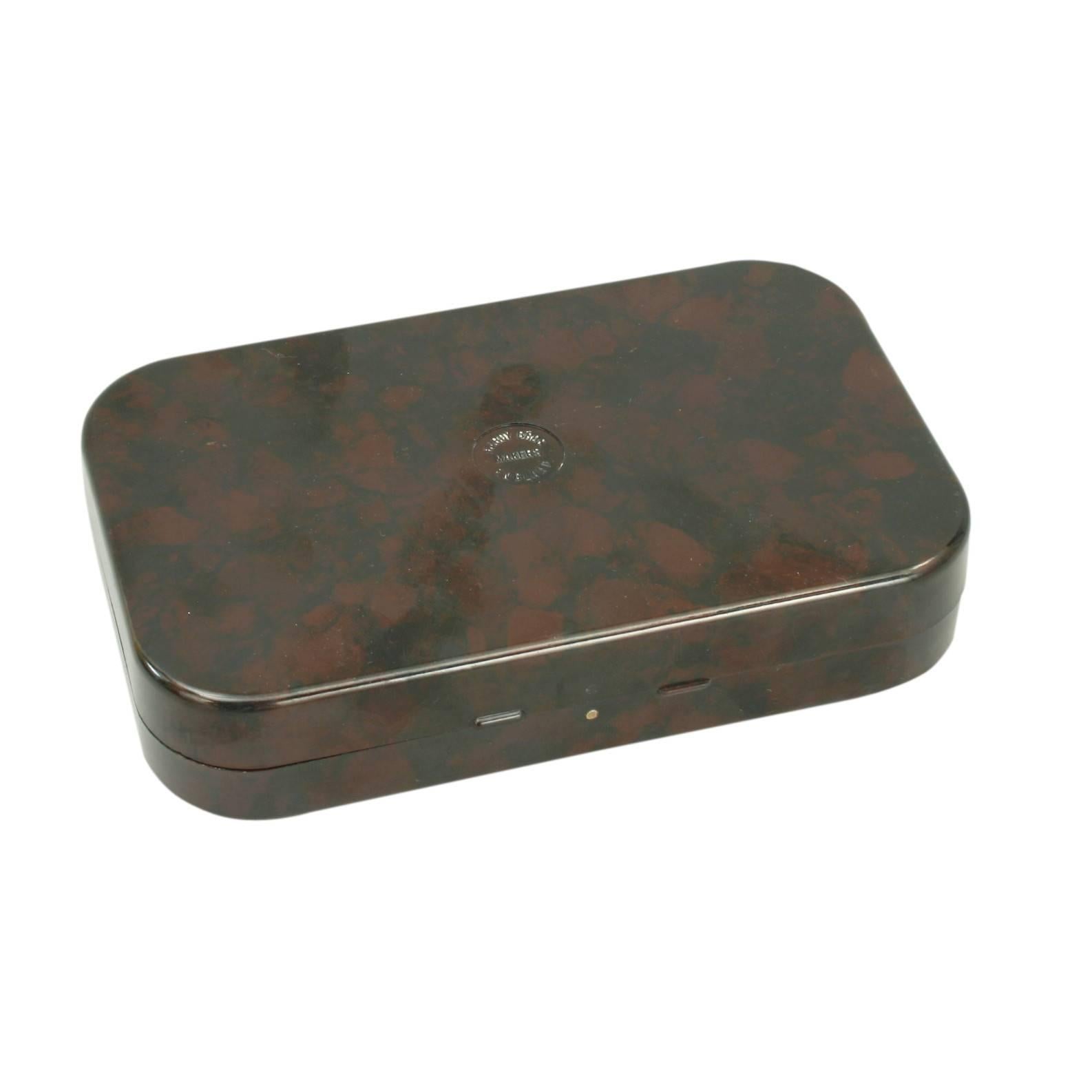 Vintage Hardy Neroda fishing fly box. 
A good Neroda wet or dry fly box made from bakelite with a blood red tortoiseshell finish manufactured by Hardy's of Alnwick. The flies are hooked over the chenille covered bars and can not drop out or change