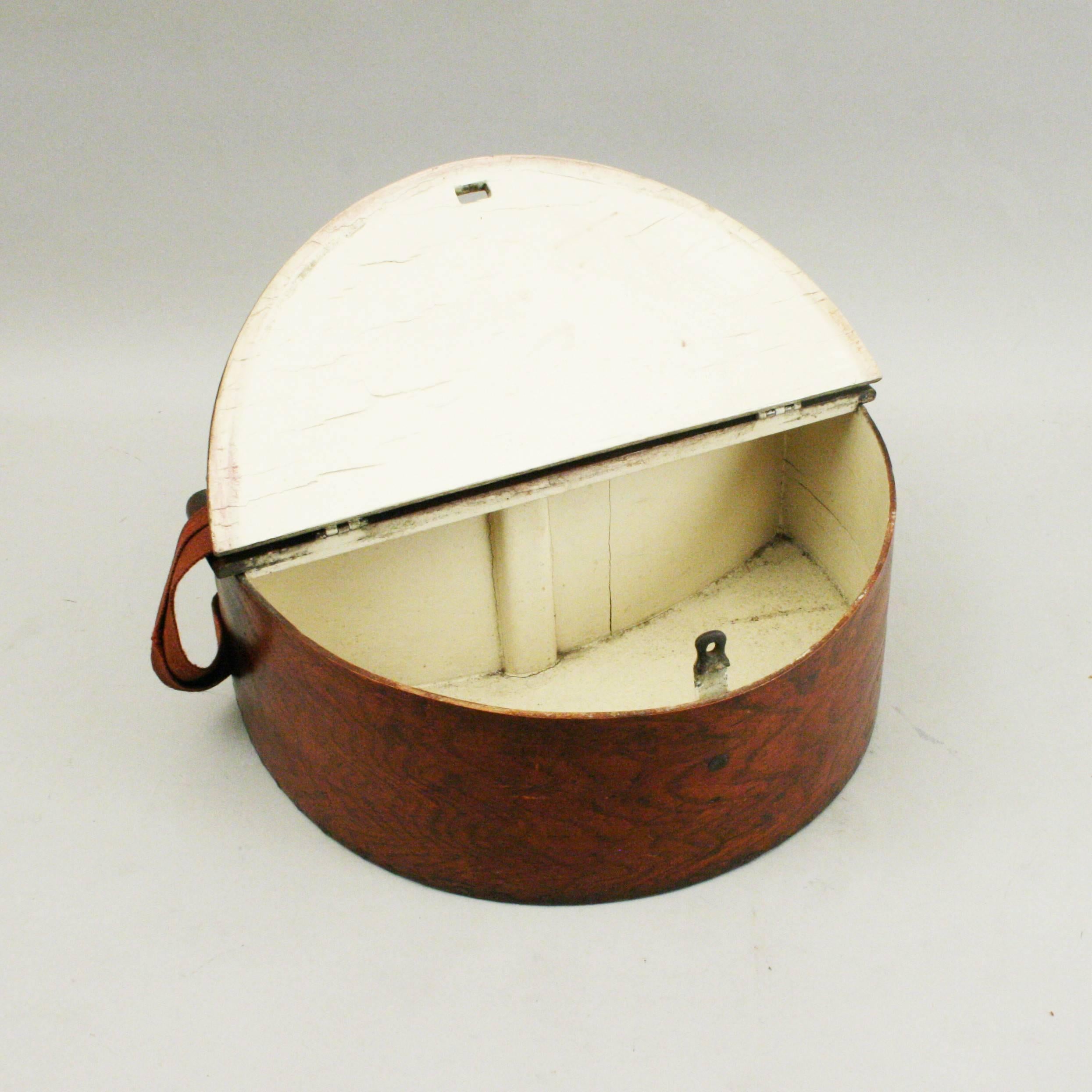 Antique fishing creel. 
A late 19th century shaped wooden fishing creel, the inside with traditional white paint, the lid with a brass sprung catch and a hole for locking it. The back is also shaped to fit your body. A canvas shoulder strap, fitted