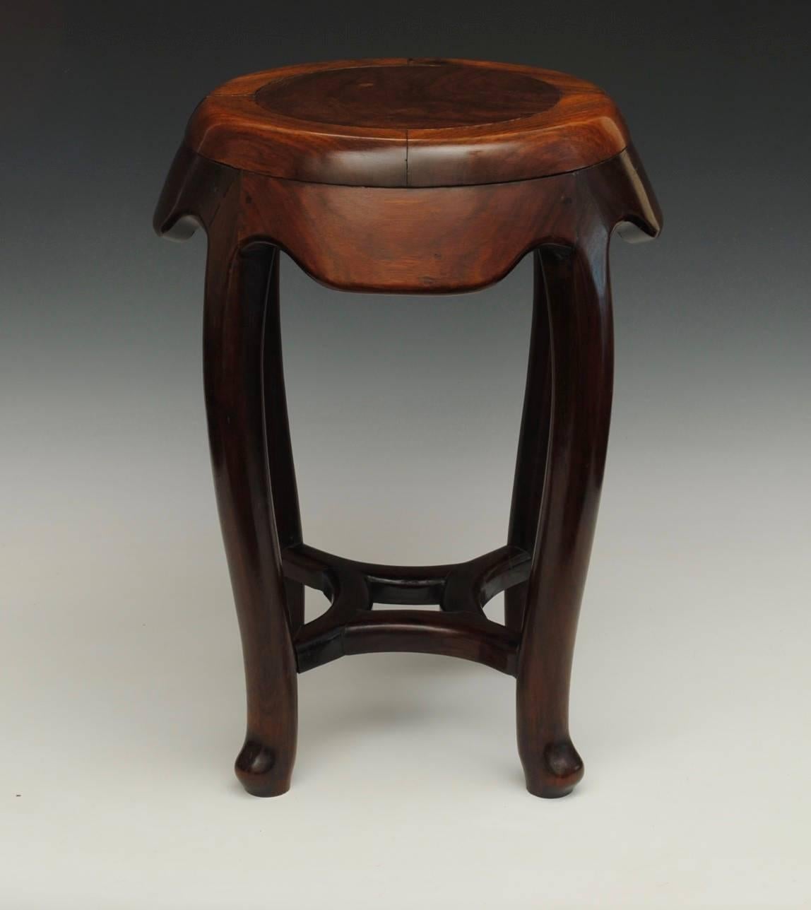 An elegant Chinese hardwood barrel stool.