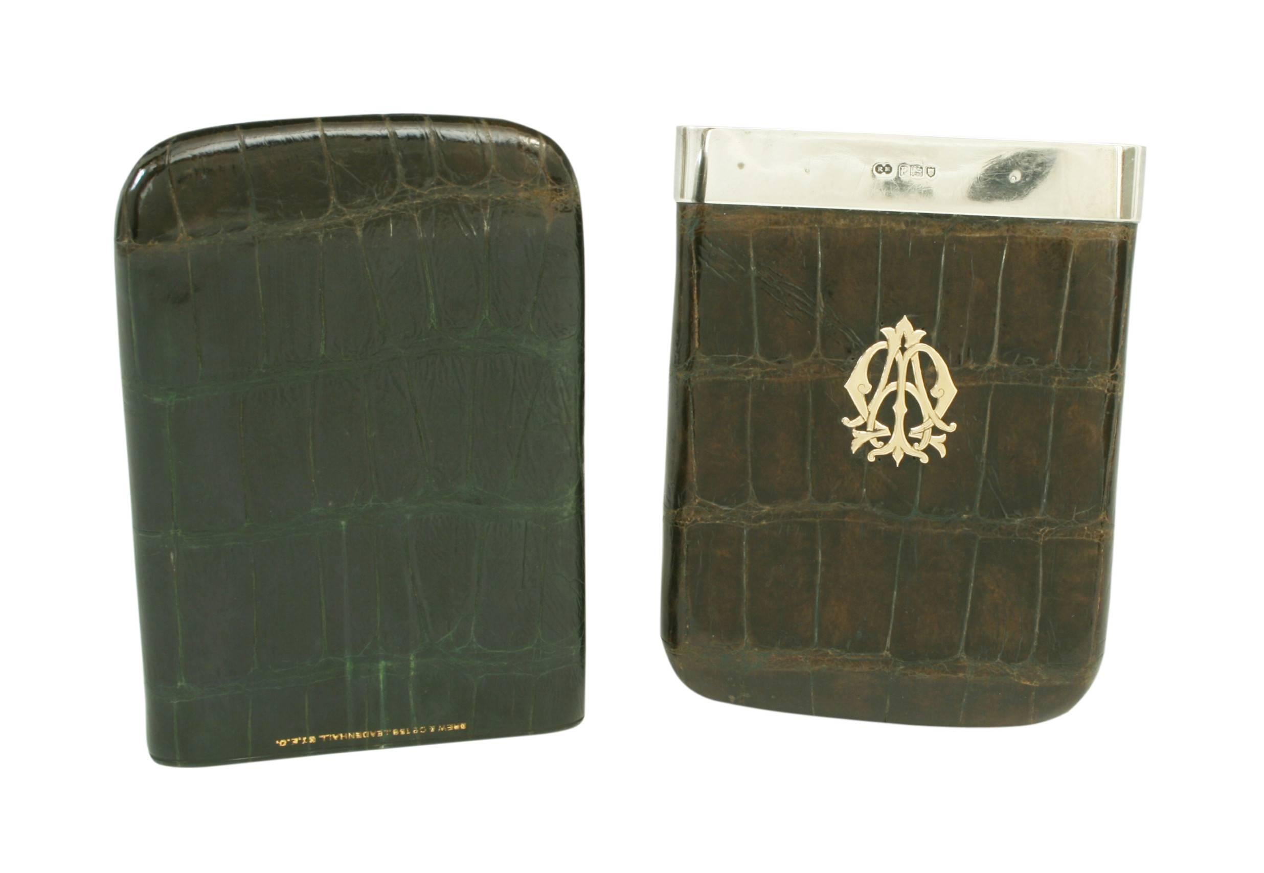Leather cigar case with silver fittings.
Crocodile leather cigar case with silver mount. The mount is hallmarked, London 1910 with the silver smith mark 'R.M', possibly Robert Marshall from Holborn, Central London. The leather with gilt stamp 'Drew