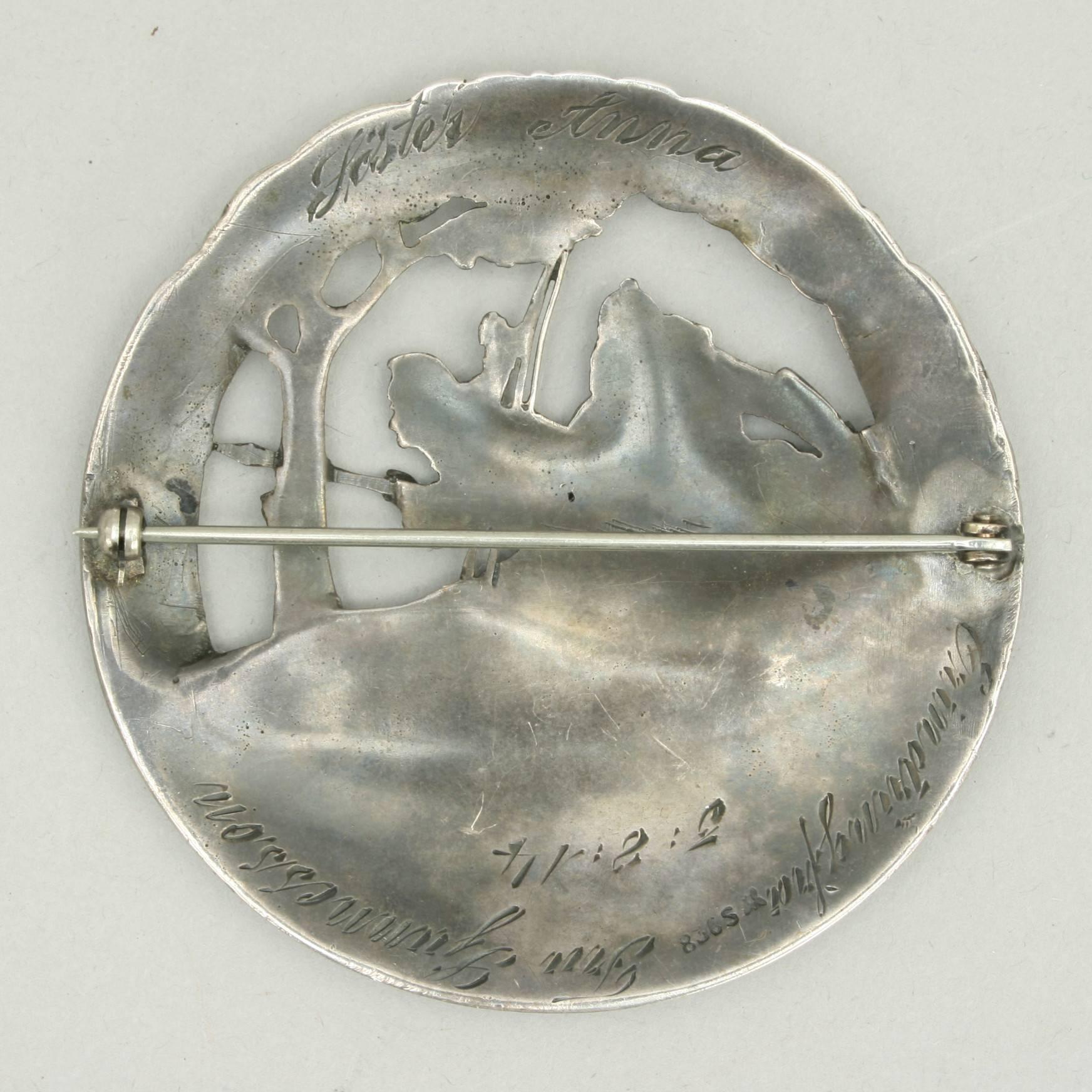 Skiing birchlegs crossing the mountain with the royal child.
An unusual brooch with a scene of skiing Vikings, 'The Birch Legs'. The Norwegian Sterling Brooch is hallmarked '830 S' and is of a very fine casting. Impressed around the outer edge is '