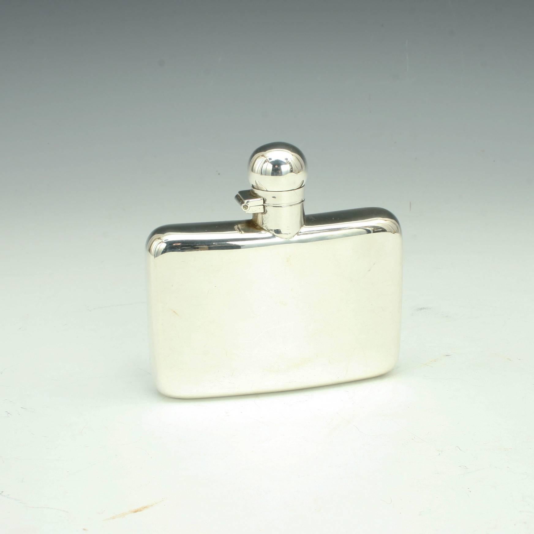 Small silver hip flask. 
A beautiful small silver hip flask with curved back. The flask with simple bayonet screw top lid. A very nice piece, hallmarked London, 1904, with manufactures details S.I. Ltd. Stokes & Ireland Ltd (William Henry
