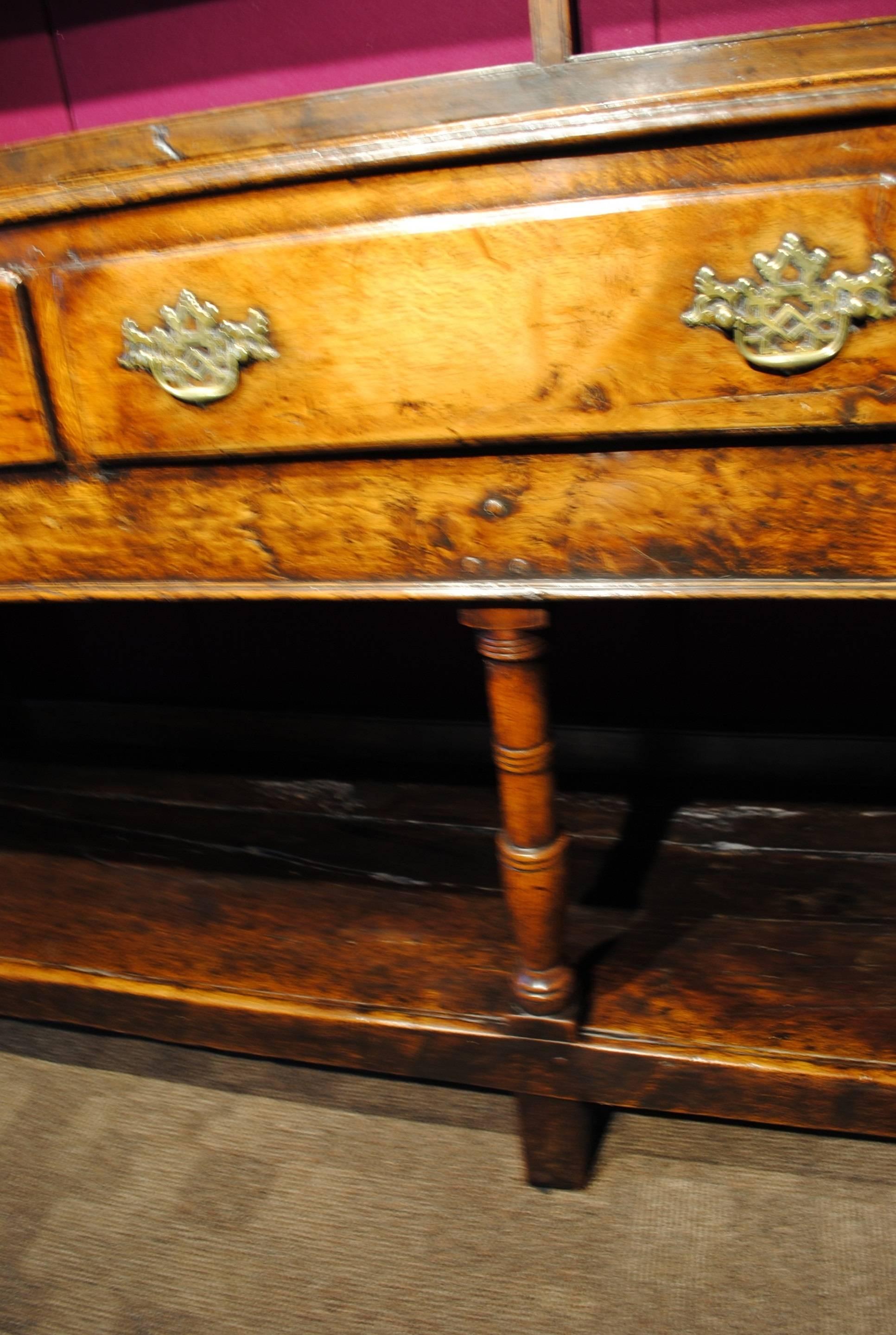 A good example of an 18th century dresser and original rack of fine mellow color and patina.