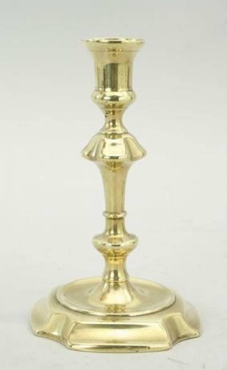 A very nice pair of Georgian brass candlesticks. The bases are square with cut corners and the sticks are of seamed construction.