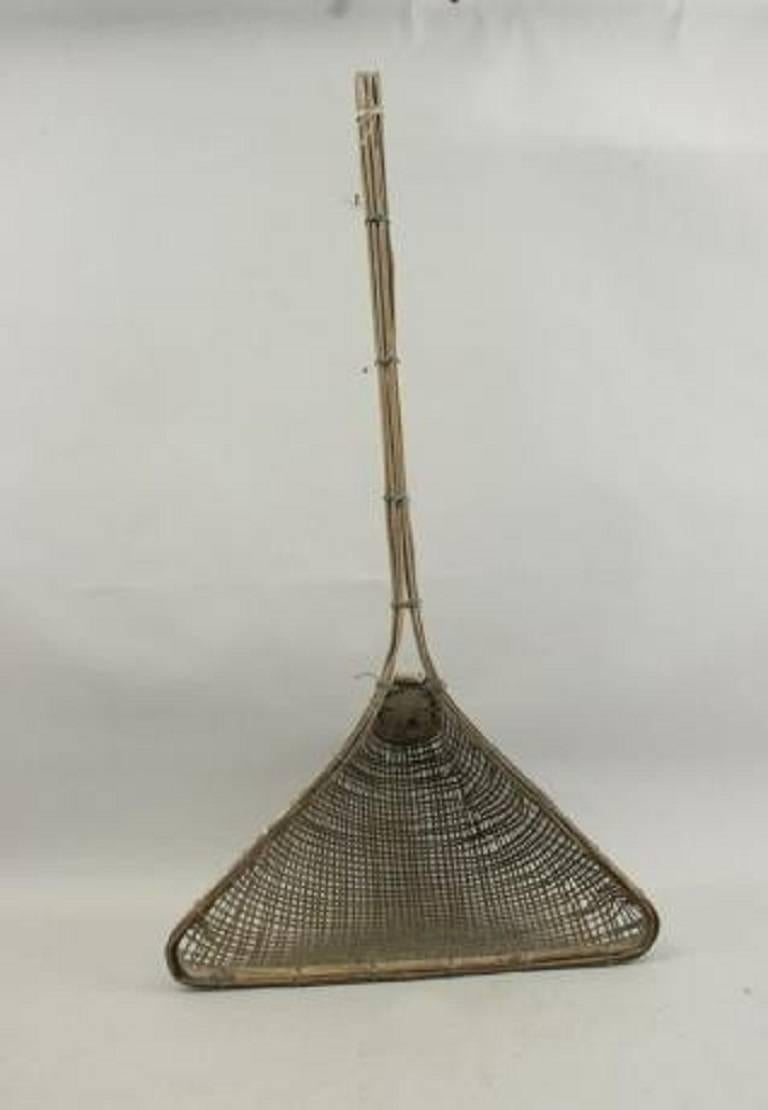 A prawn fishing net of triangular design. The frame and actual net made of split bamboo. A very unusual and attractive fishing net ideal as a display piece.