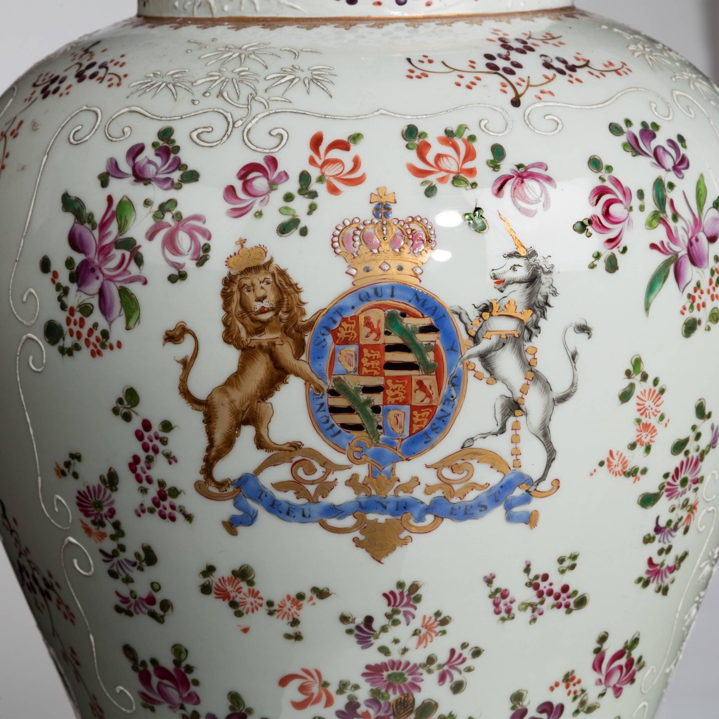 A pair of Continental white porcelain vases with royal coats of arms, converted into lamps.