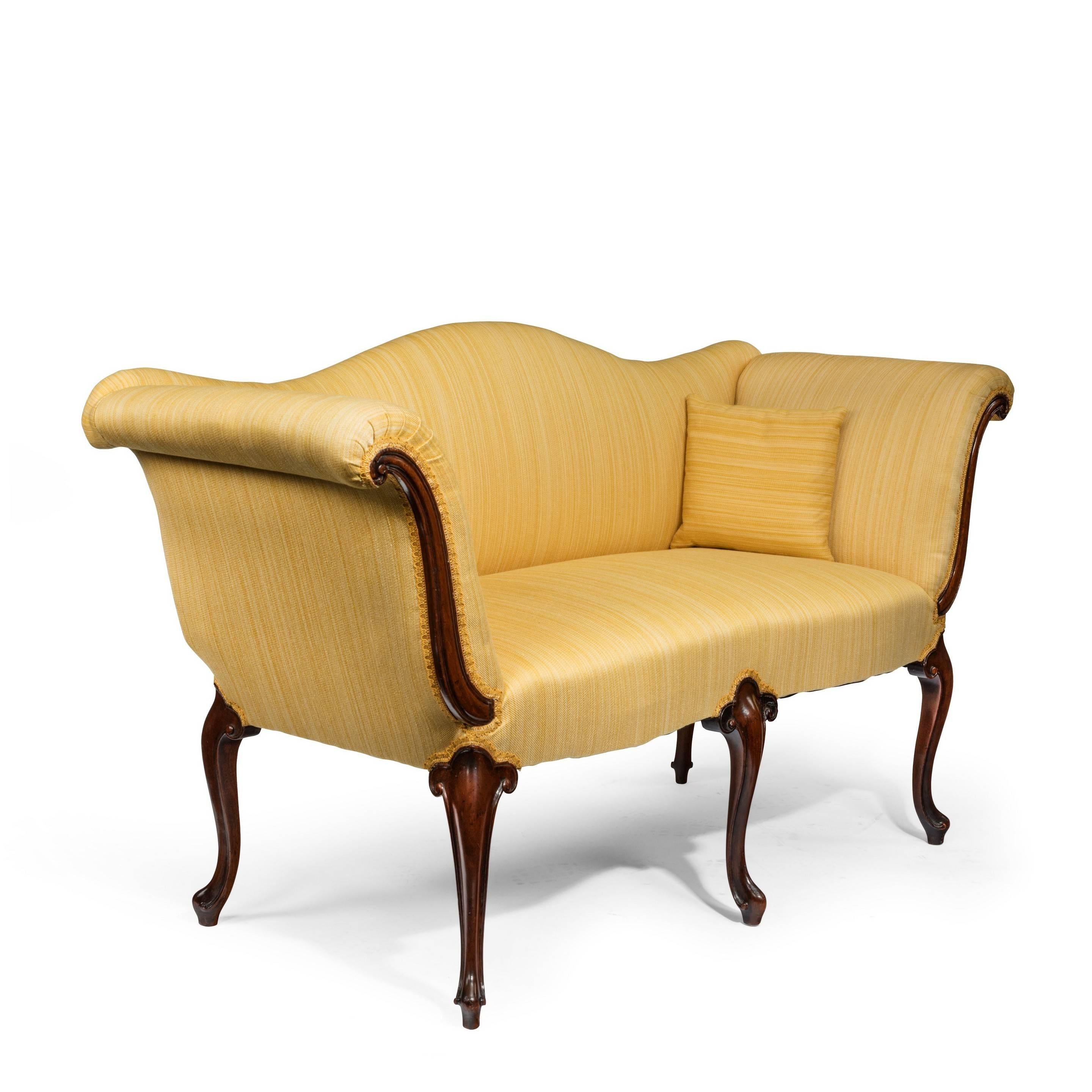 Pair of Victorian Hepplewhite style mahogany window settees, each of small proportions with arched back and shaped front with a central leg, re-upholstered in yellow gross grain.