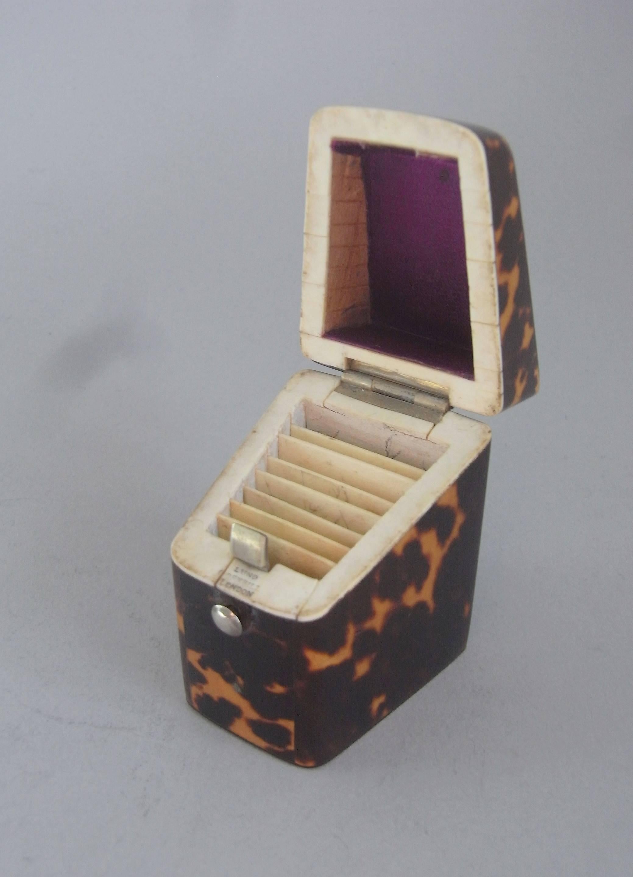 This very rare Tortoiseshell Needle Case is unusually modelled as a Georgian Knife Box and displays a vacant silver cartouche on the cover. The hinged cover also opens up to reveal a velvet lined interior with seven ivory divisions so that the
