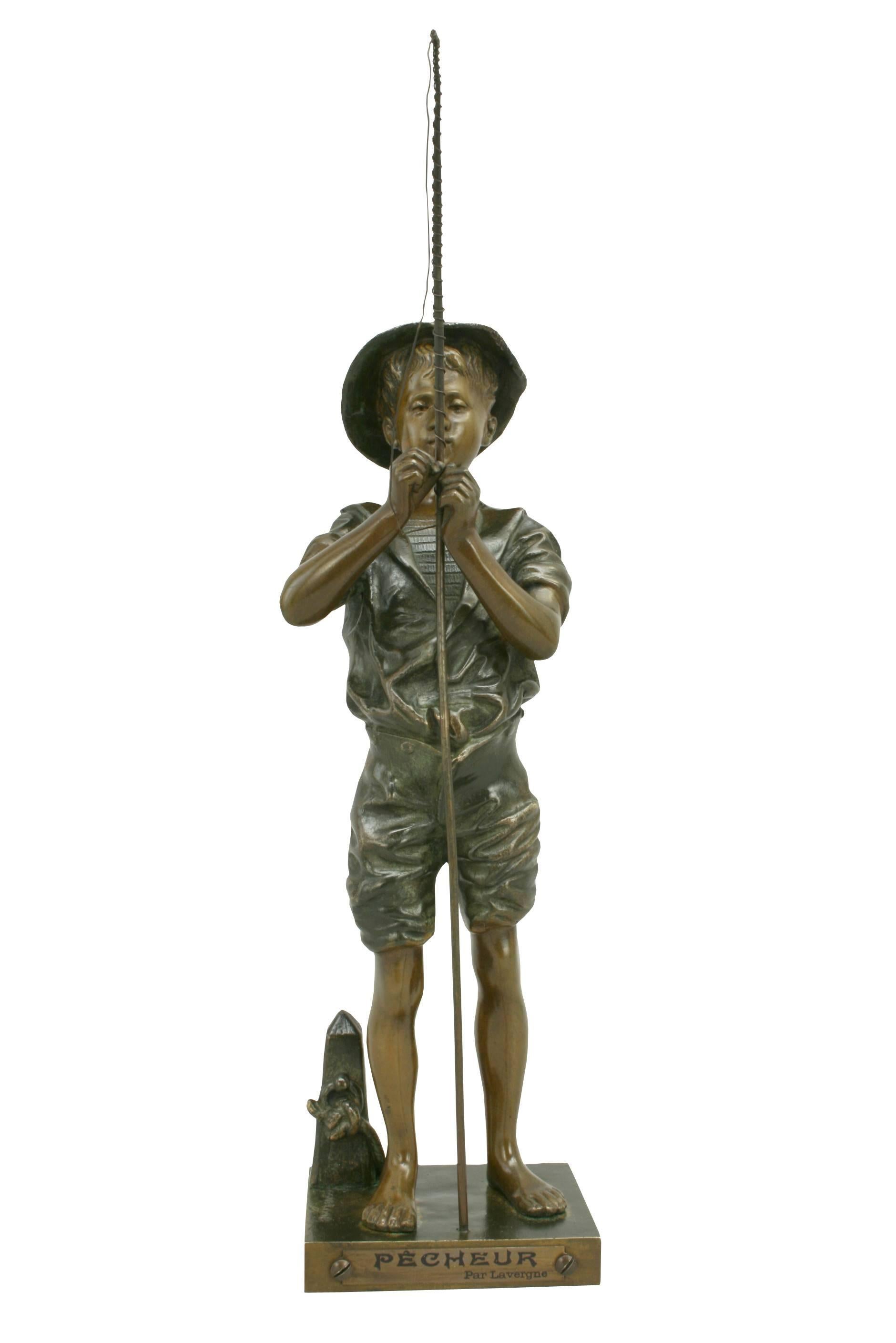 A wonderful French bronze sculpture of a fishing boy by Lavergne. The figure is two tone patinated bronze and mounted on a rectangular plinth with impressed Lavergne signature with a brass plaque mounted on the front with title and artist on it