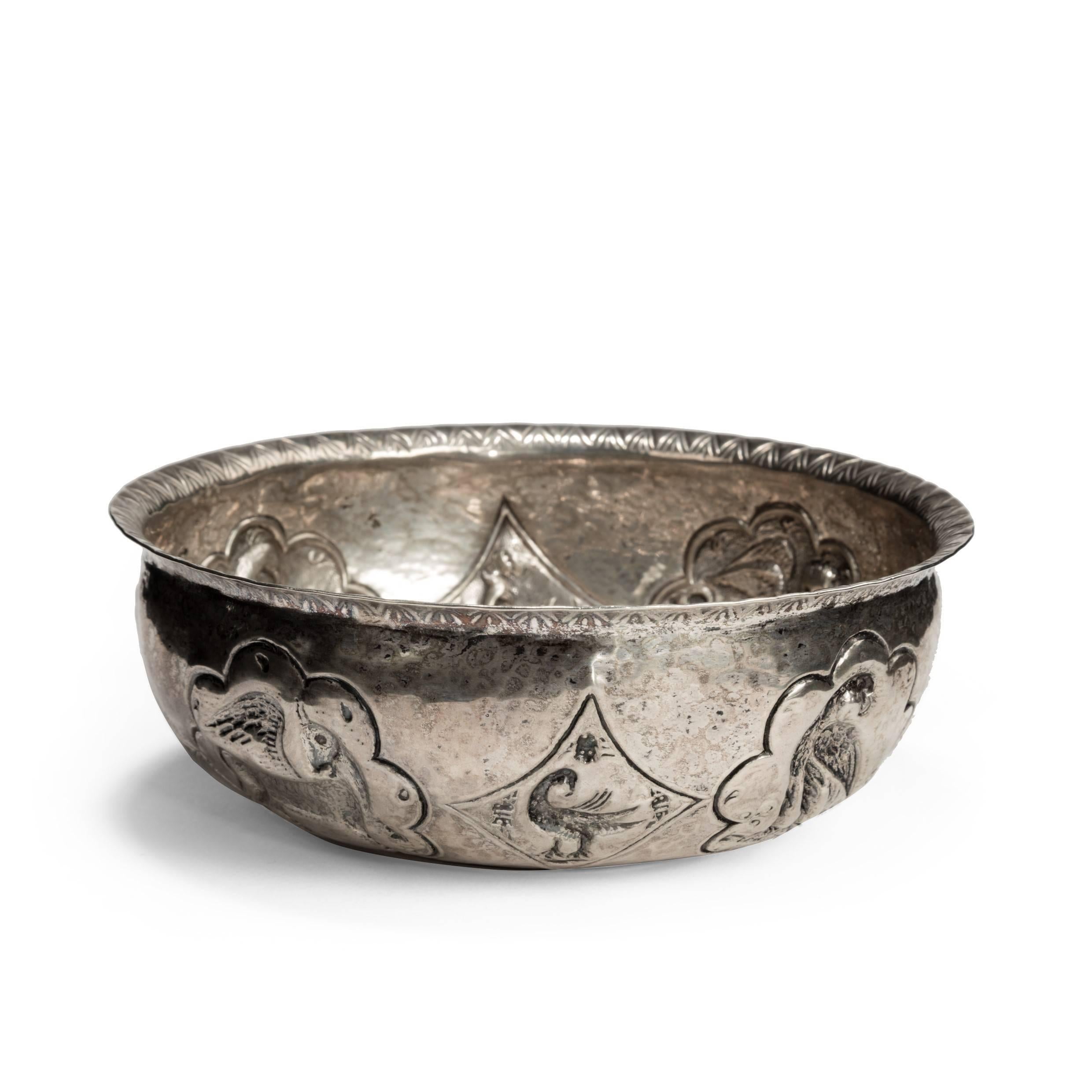 A rare antique Balkan silver-gilt bowl with repousse decoration round the curvetto of alternate lobed and diamond cartouches enclosing mythical beasts and birds, including the winged lion of St Mark, the central boss with a double cruciform design