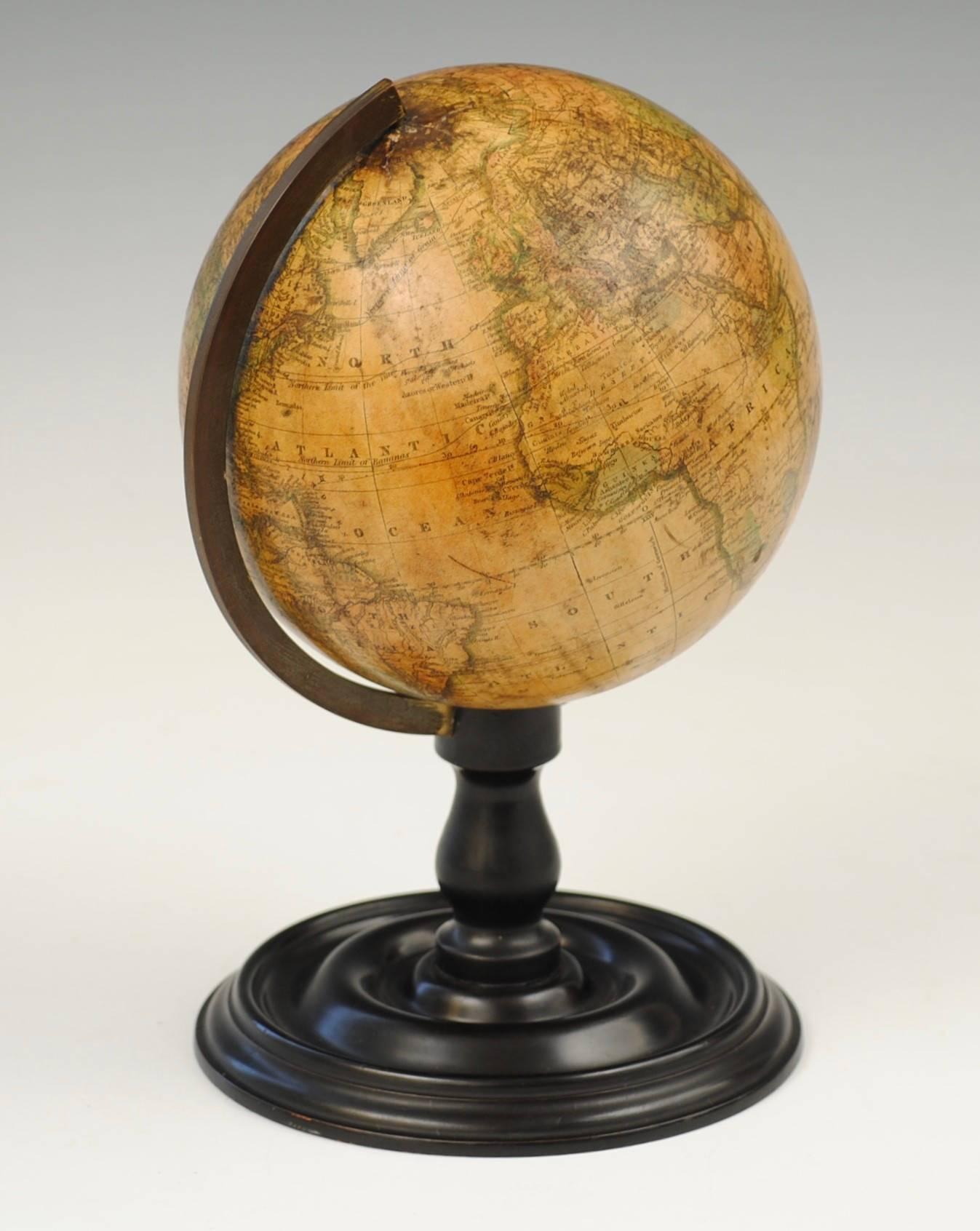 A good example of a 19th century terrestrial globe by Joslins, Boston on a turned and ebonized stand.