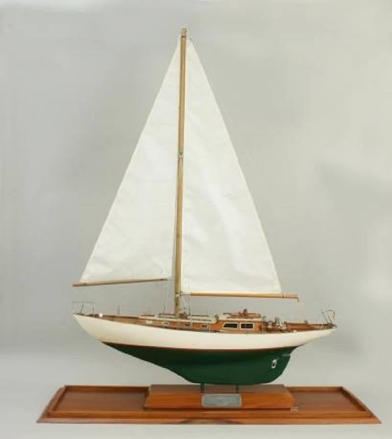 An exceptional high quality model of the Kim Holman designed Whirlaway of Percuil. The model is intricately detailed with simulated planked deck, hand rails, rudder and propeller, ships wheel and rigged sails in excellent condition. The model boat