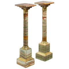 A pair of amber coloured African onyx columns